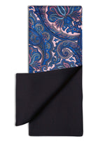 'The Trafalgar' dress scarf arranged in a rectangular shape clearly showing the baby pink and blue paisley patterns, enhanced with fuchsia accents. The bottom-right quadrant is folded back to reveal the fine woollen lining underneath the pure silk exterior.