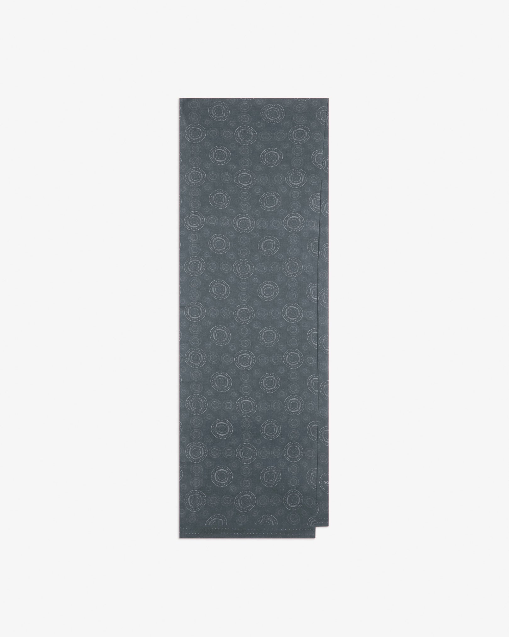 The 'Circles' graphite bohemian wide scarf folded and presented vertically to show the full dimensions and repeating concentric Op art-inspired disc pattern in graphite tones.