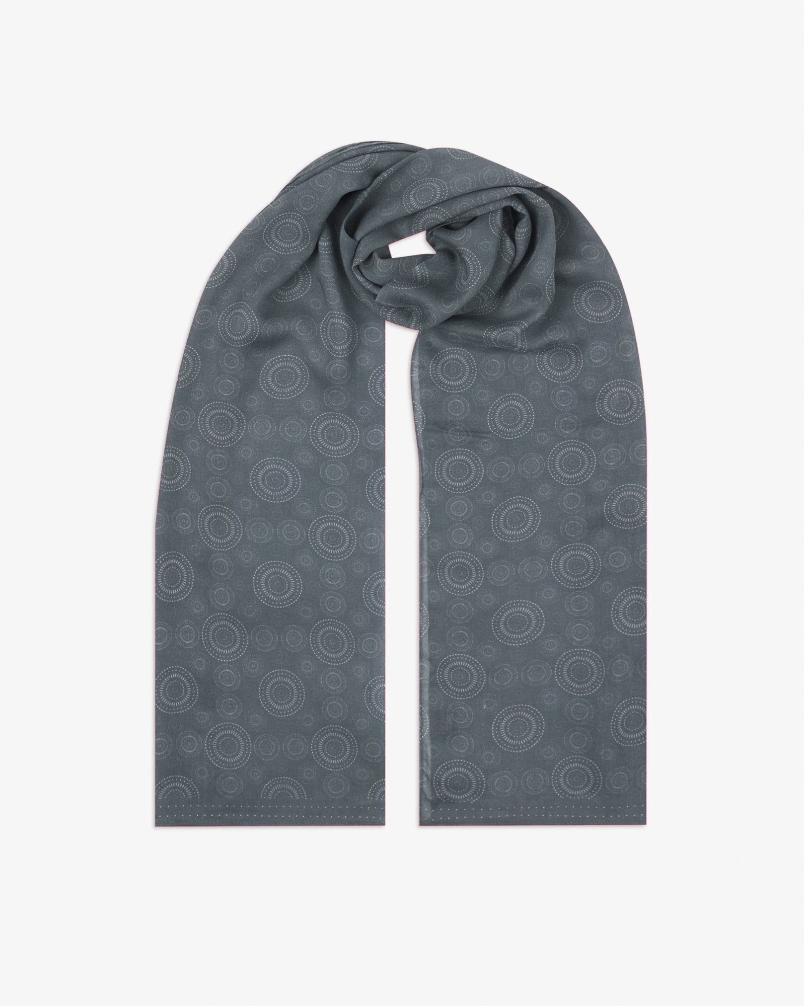 The 'Circles' graphite bohemian wide scarf looped with both ends parallel, showcasing concentric Op art-inspired disc motifs in graphite tones across the soft modal and wool blend fabric.