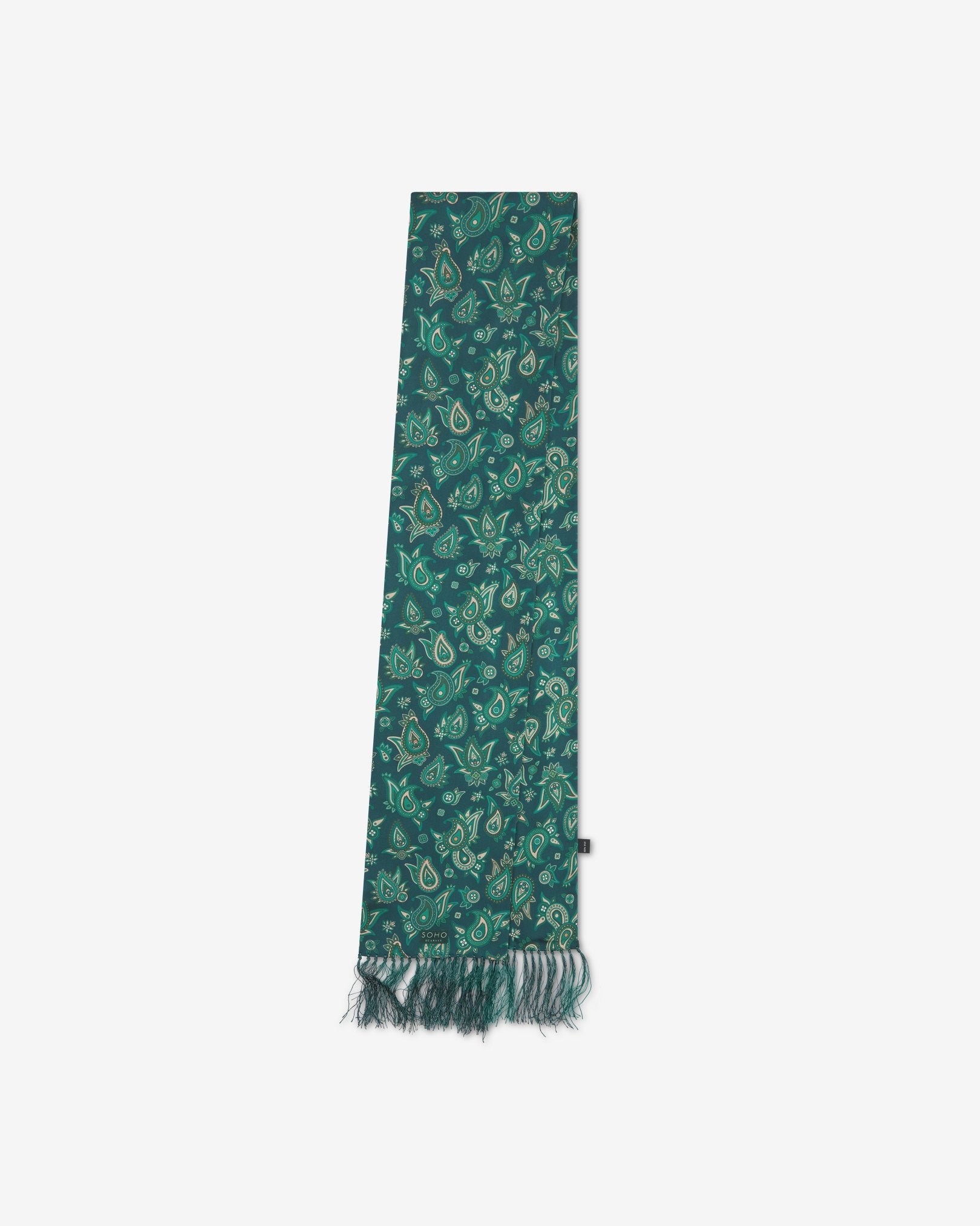 The 'Grassmere' emerald-green silk aviator scarf folded and presented vertically illustrating the full scarf dimensions and dark green fringes.