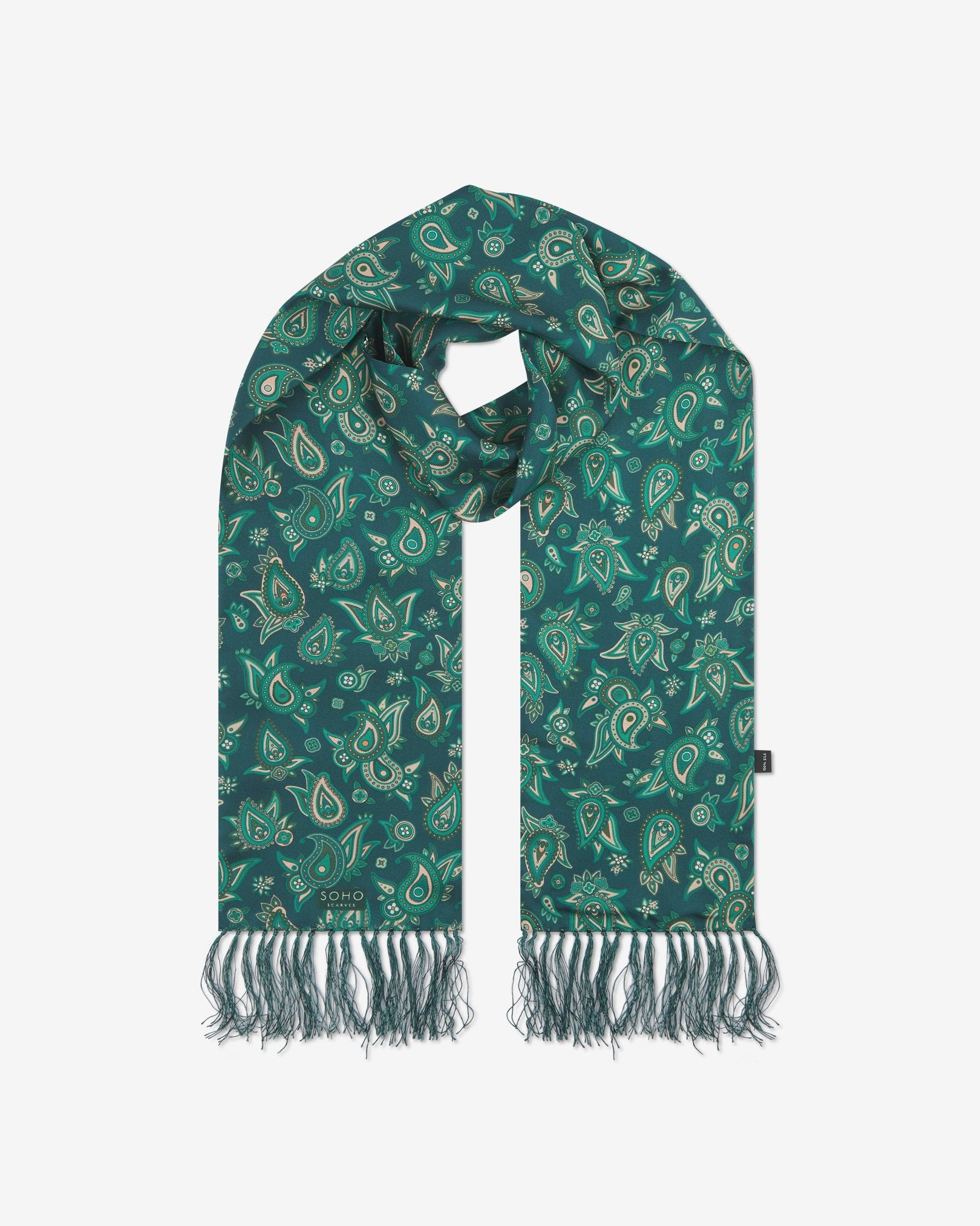 The 'Grassmere' emerald-green silk aviator scarf looped with both ends parallel to effectively display the full repeat pattern of green and salmon pink paisley patterns and fringes.