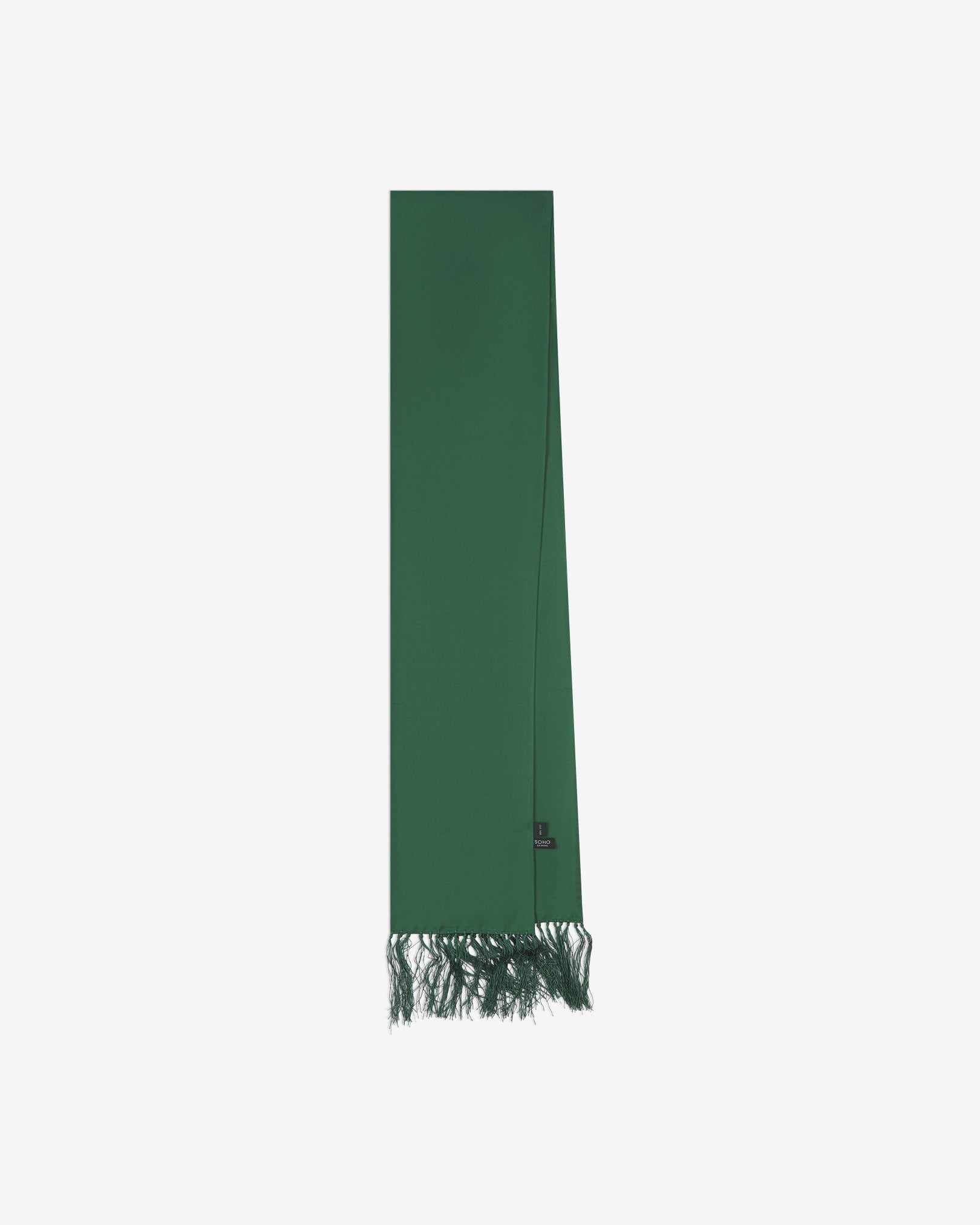 The green silk aviator scarf folded and presented vertically illustrating the full scarf dimensions and matching green fringes.