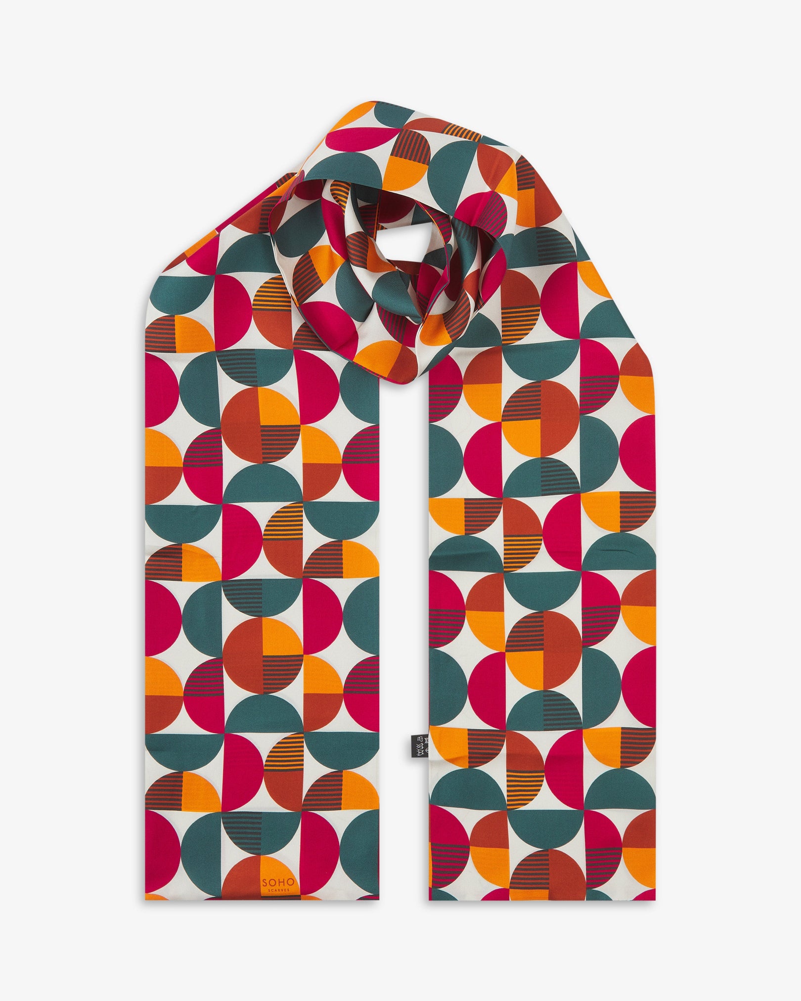 The 'Kassel' Bauhaus-inspired silk scarf knotted and looped against a white background.