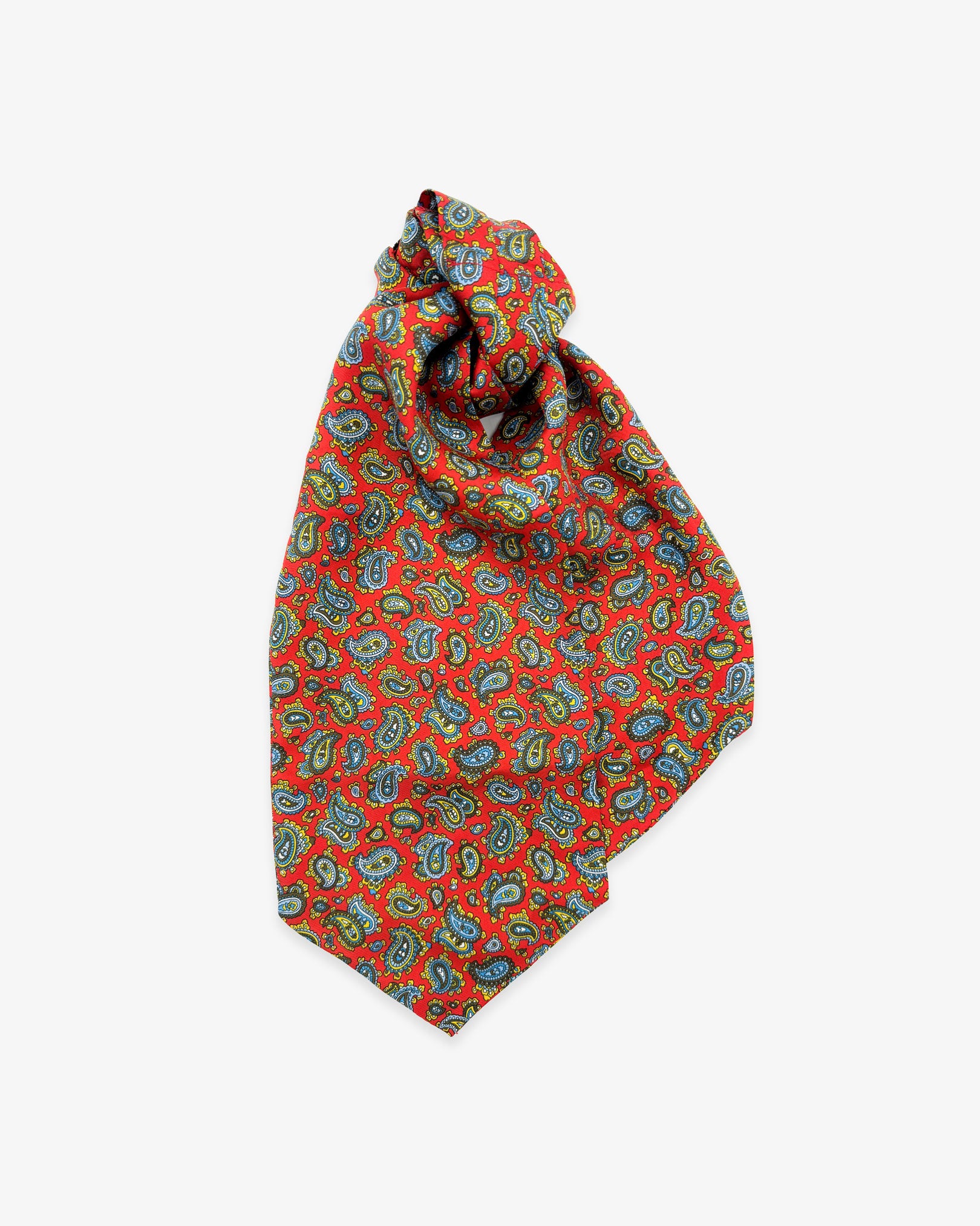 Entire view of 'The Shinjuku' double Ascot tie with wide ends at the bottom and clear view of the small cyan, brown and gold paisley patterns complemented by white accents on a red background.