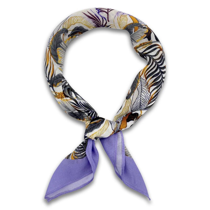 The Andes bandana knotted loosely into a loop, indicating the range of earthy and purple tones of the modal-wool fabric.