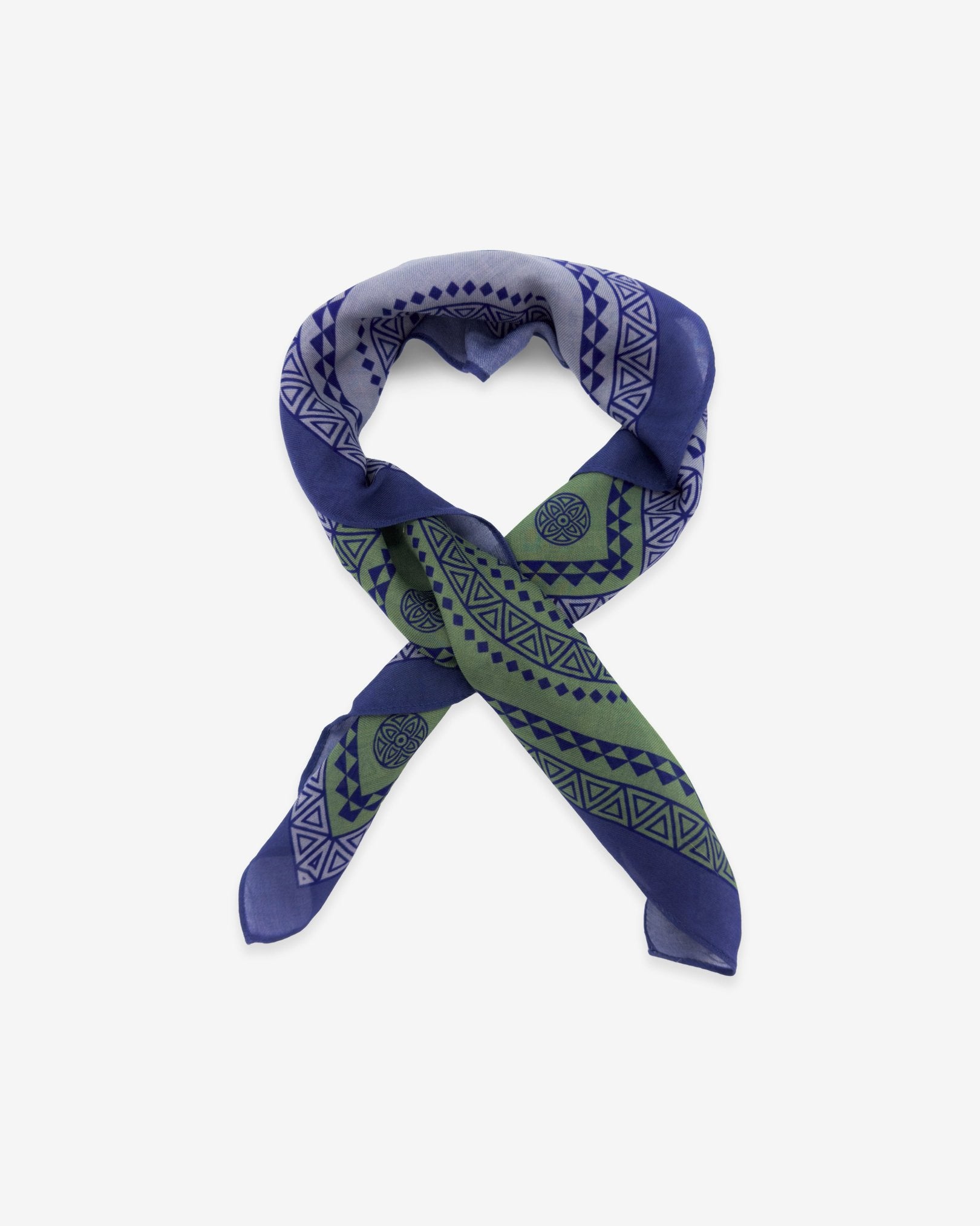 The Lublin purple bandana featuring a blue, green and violet pattern by John Greene. Knotted into a loop against a white background.