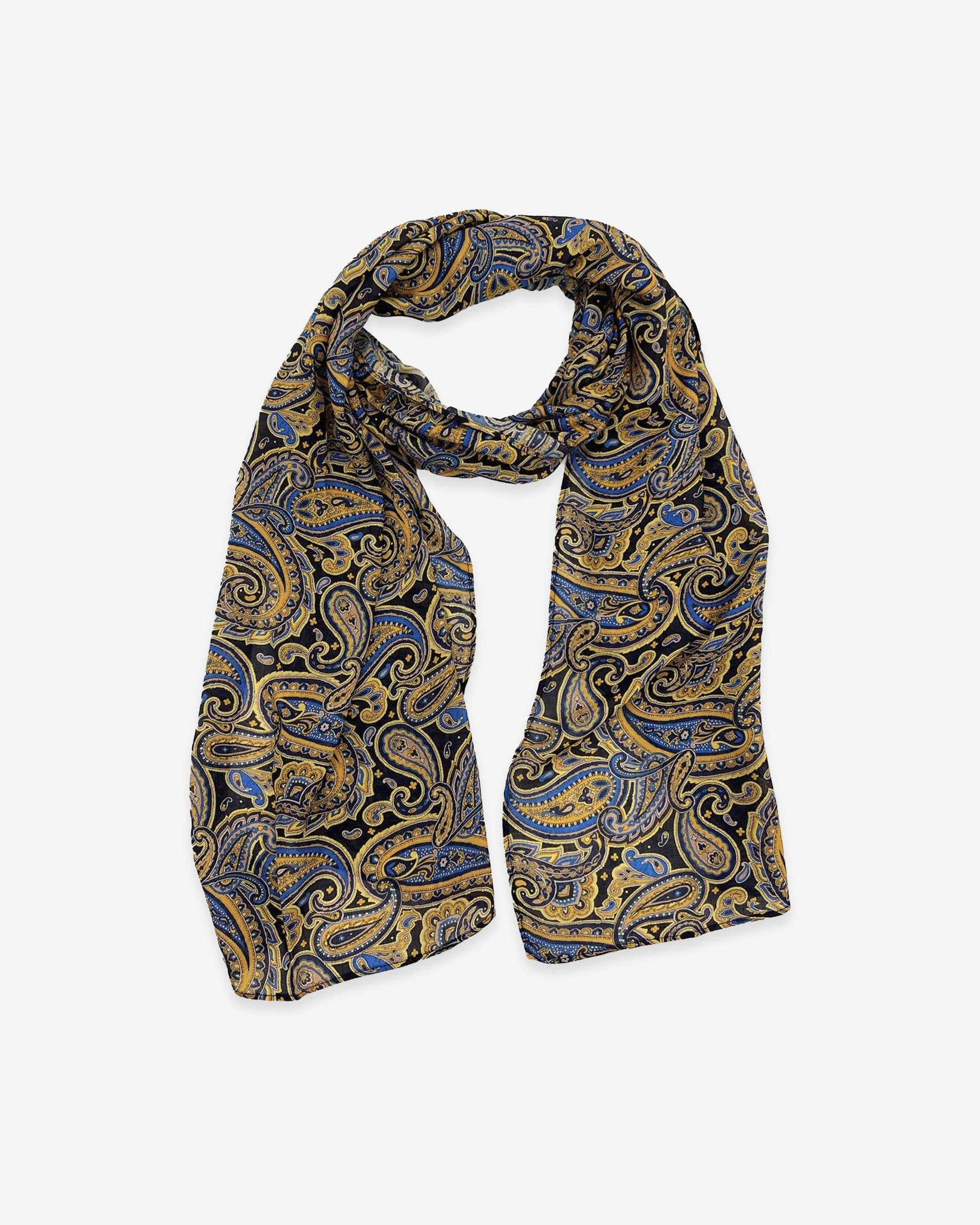 The Ormond wide scarf unravelled and looped in the middle, demonstrating the considerable length and showing blue, yellow and gold patterns on a black ground.