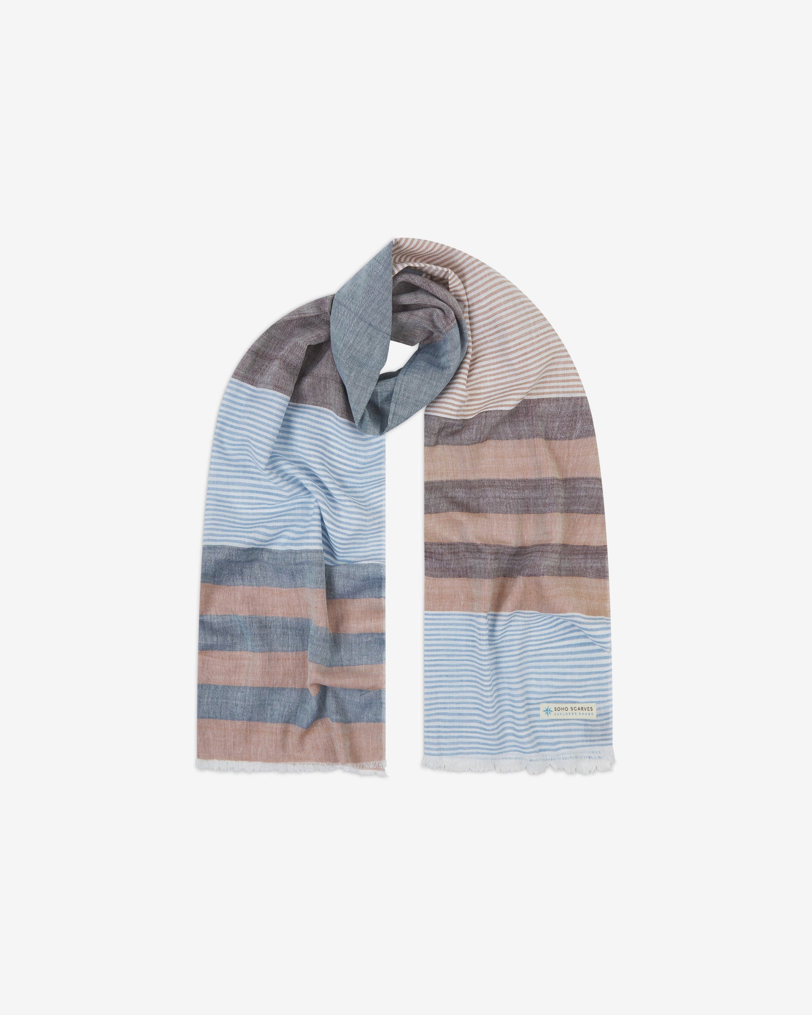 The 'Adams' cotton heathered scarf, looped in middle with both ends parallel. Displaying the patchwork pattern of browns, blues and white and the SOHO Scarves Explorer Range branding logo in the bottom-right.