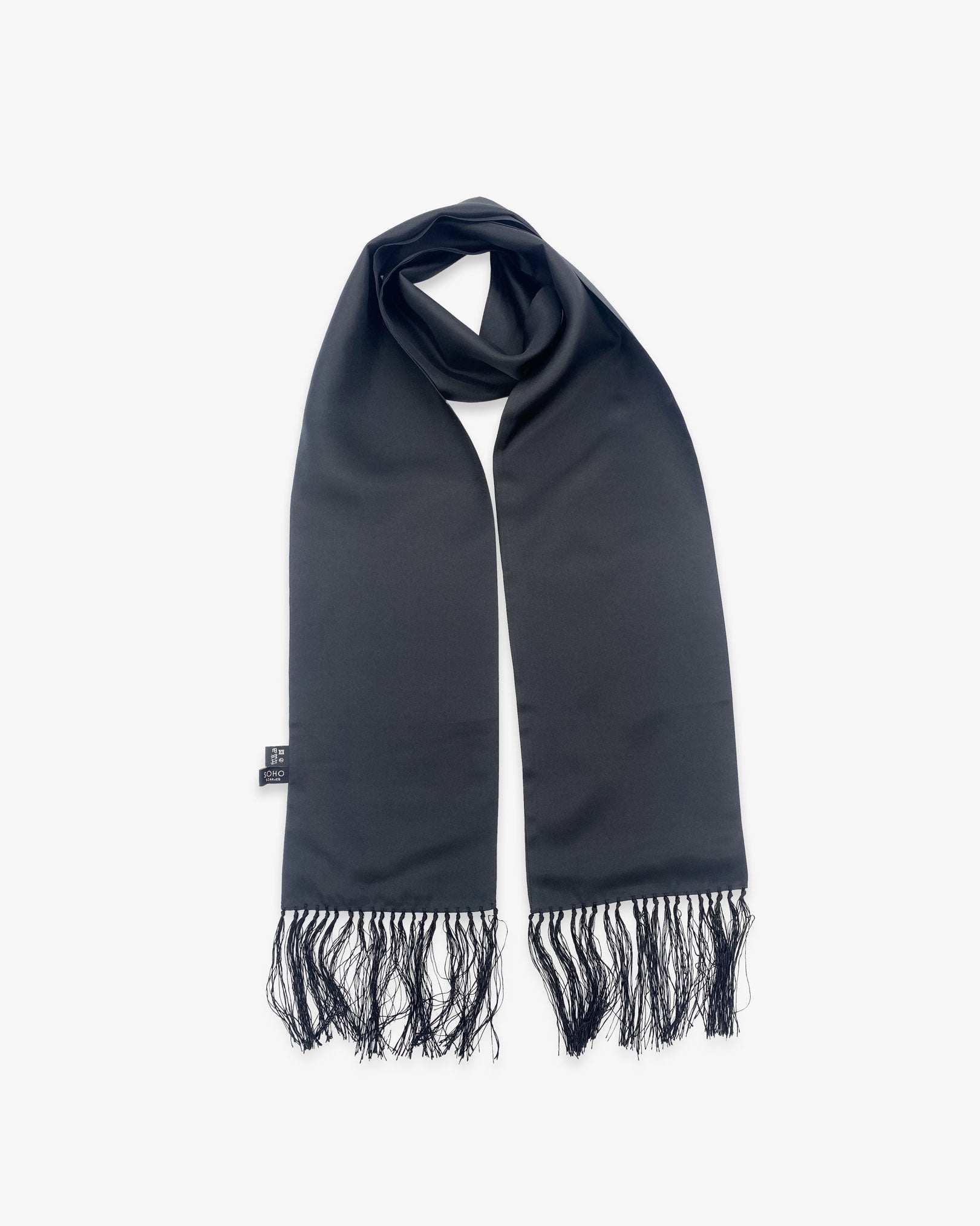 Looped view of the 'Air Black' silk aviator scarf, clearly showing the black scarf and matching 3-inch fringe.