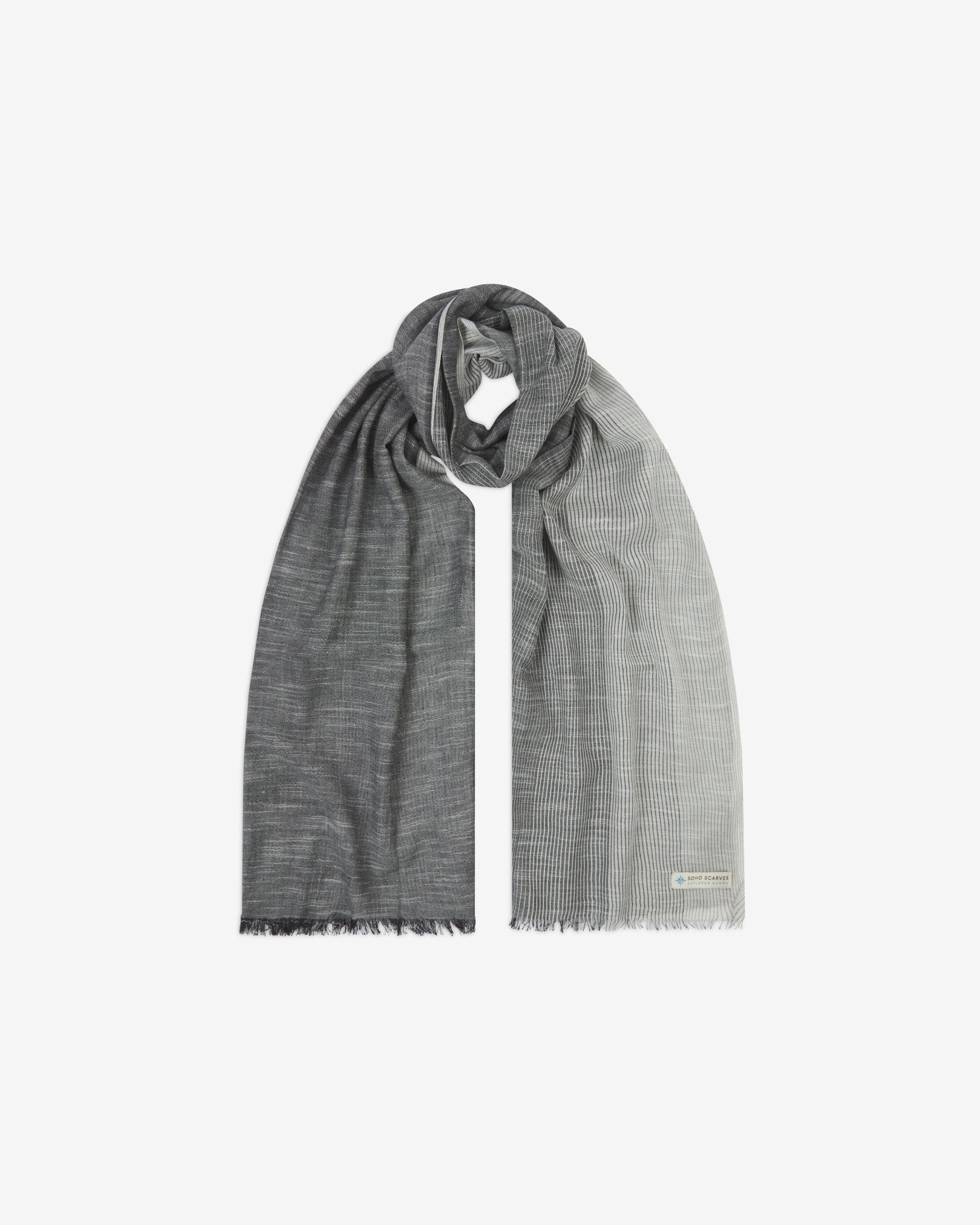 The 'Bonington' cotton monochrome scarf, looped in middle with both ends parallel. Displaying the gradient pattern of dark to light grey and the SOHO Scarves Explorer Range branding logo in the bottom-right.