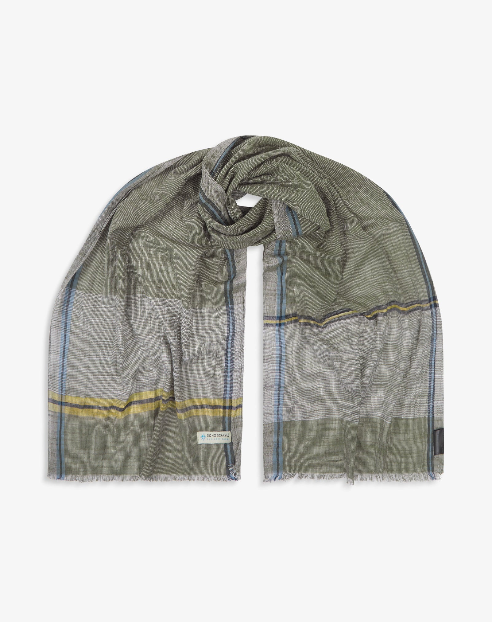 The 'Cousteau' cotton plaid scarf, looped in middle with both ends parallel. Displaying the khaki, blue and yellow yarns and the SOHO Scarves Explorer Range branding logo in the bottom-left.