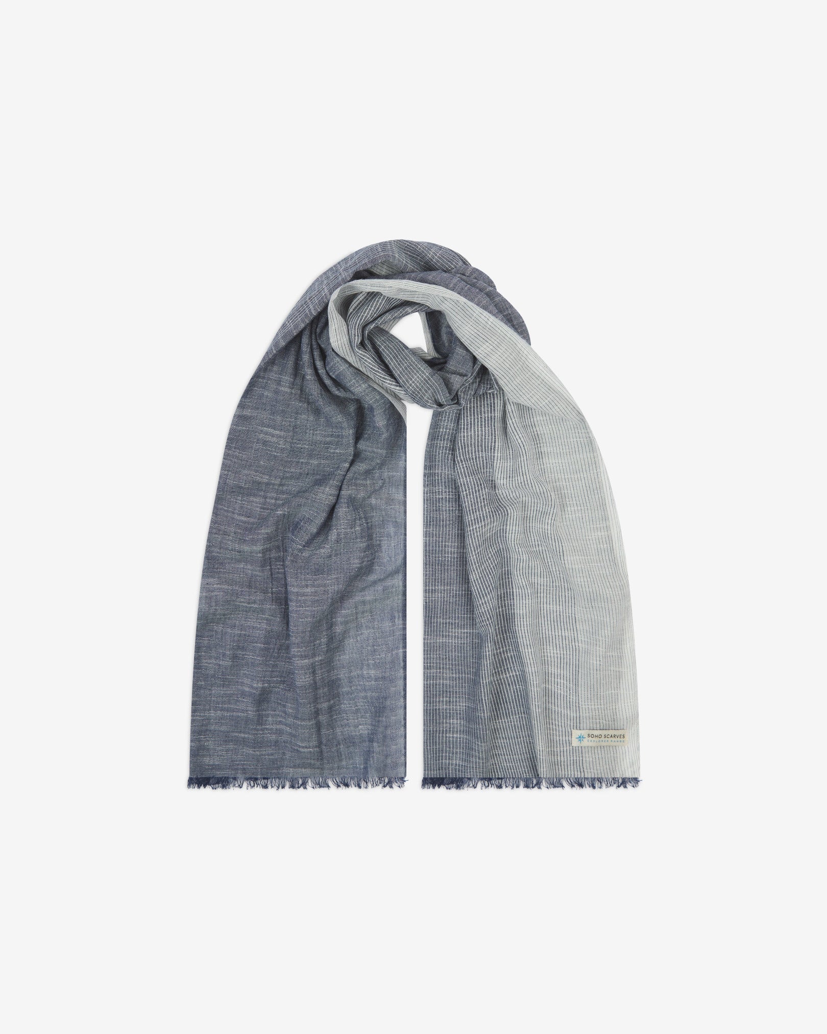 The 'Hargreaves' cotton marl scarf, looped in middle with both ends parallel. Displaying the gradient pattern of grey-blue to white and the SOHO Scarves Explorer Range branding logo in the bottom-right.