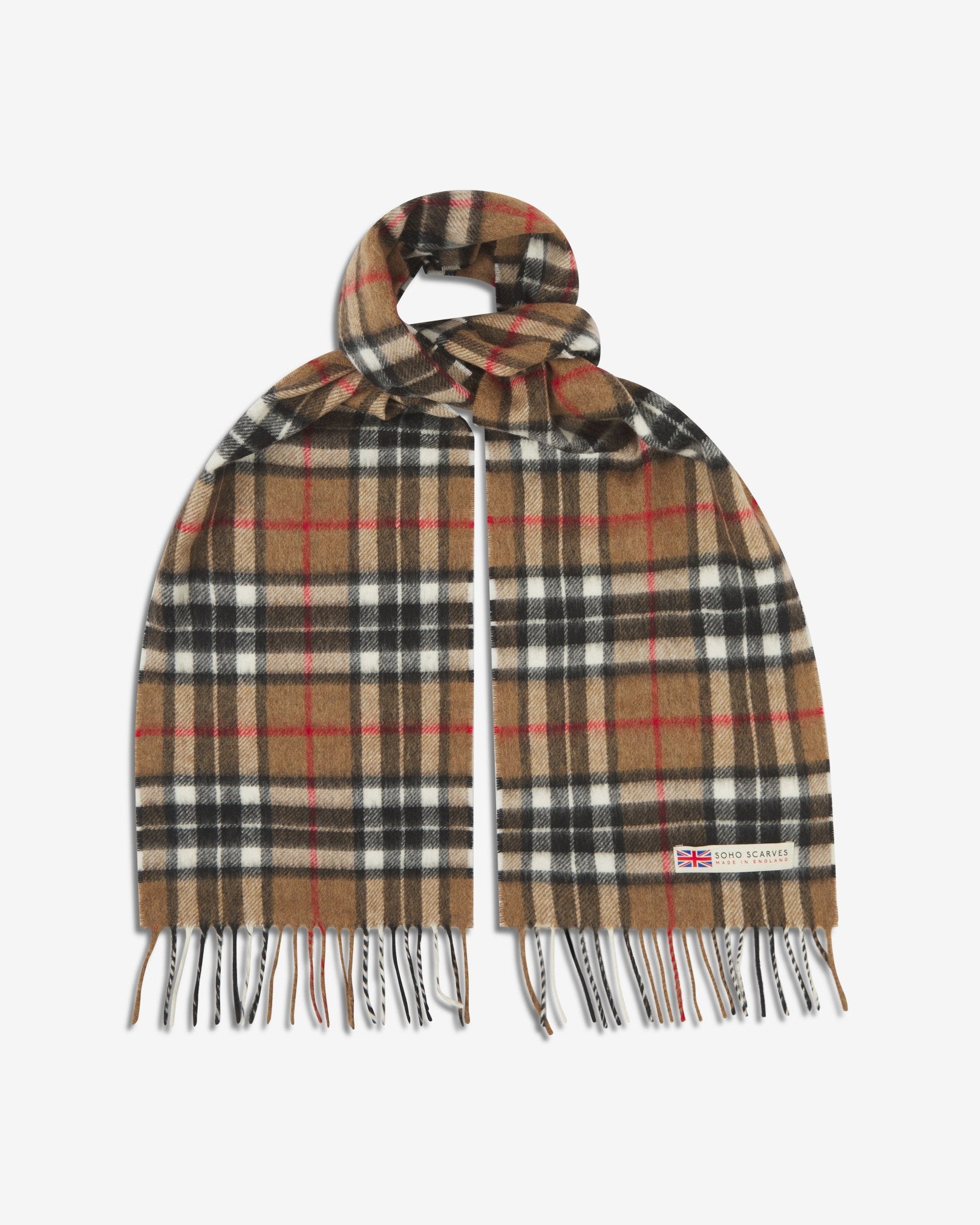 The 'Highlands' tartan in camel scarf, looped in middle with both ends parallel showing the black, white, and red patterns against a camel ground, fringing and SOHO Scarves logo with Union Jack motif.