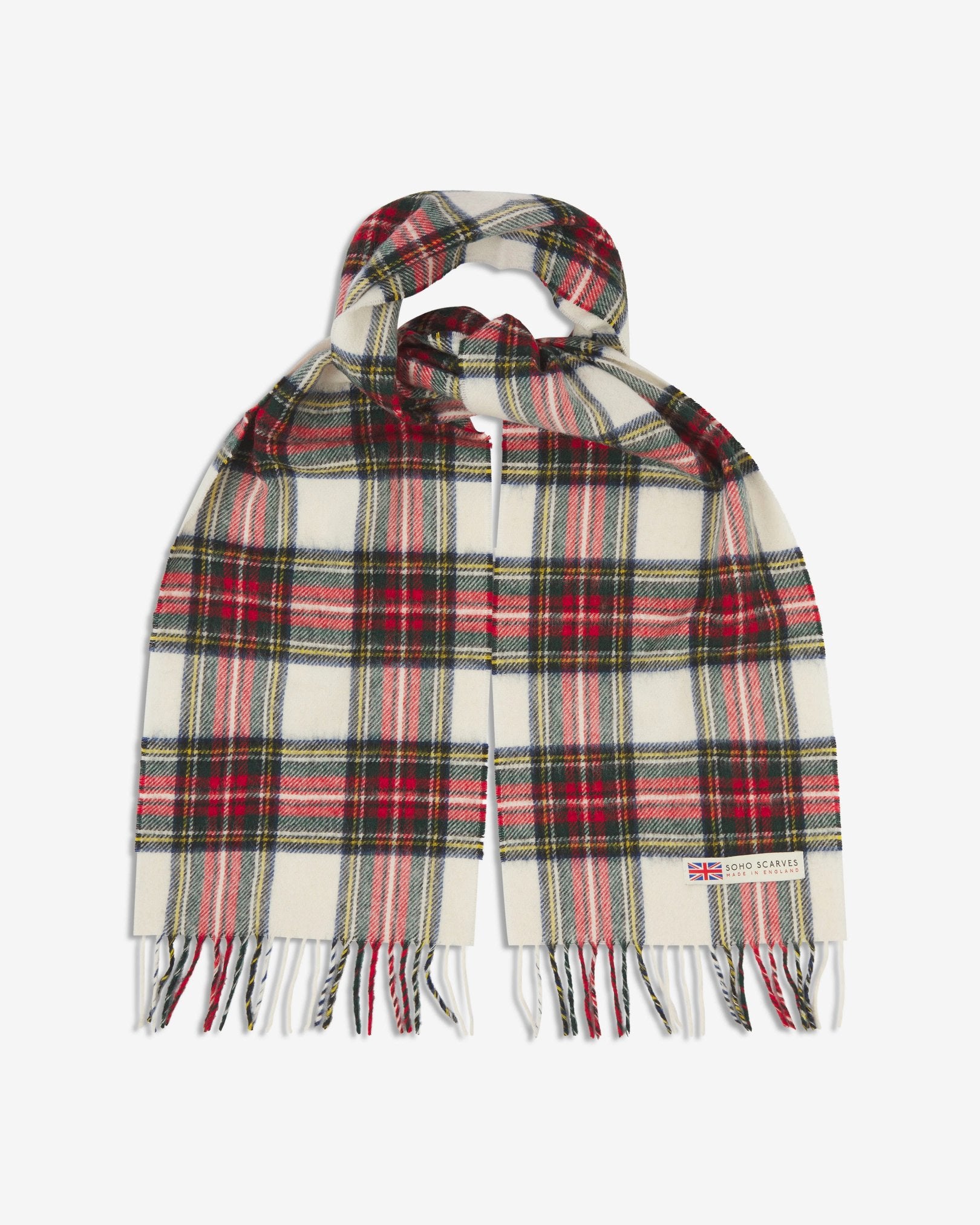 The 'Highlands' tartan dress in red scarf, looped in middle with both ends parallel showing the red patterns against a cream ground, fringing and SOHO Scarves logo with Union Jack motif.