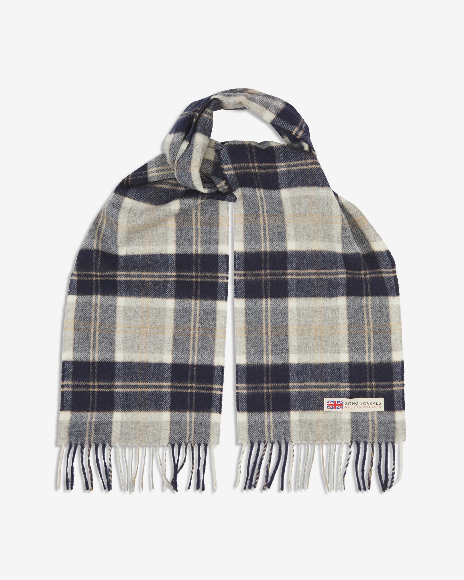 The 'Highlands' tartan in silver scarf, looped in middle with both ends parallel showing the camel, grey, and black patterns against a cream ground, fringing and SOHO Scarves logo with Union Jack motif.