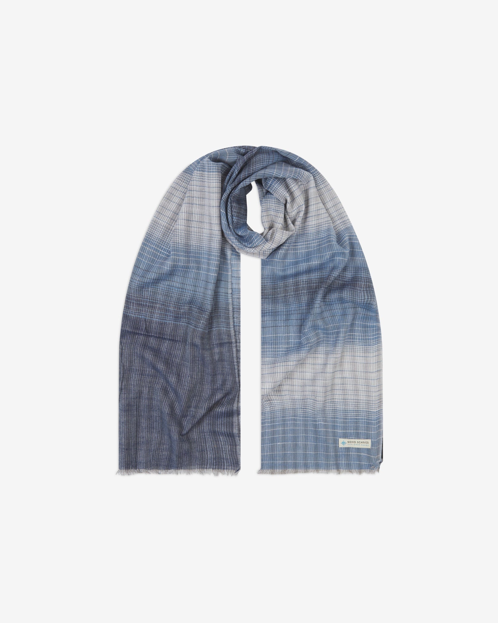 The 'Houlding' cotton blue-grey scarf, looped in middle with both ends parallel. Displaying the blue and grey gradient patterns, pinstripes and the SOHO Scarves Explorer Range branding logo in the bottom-right.