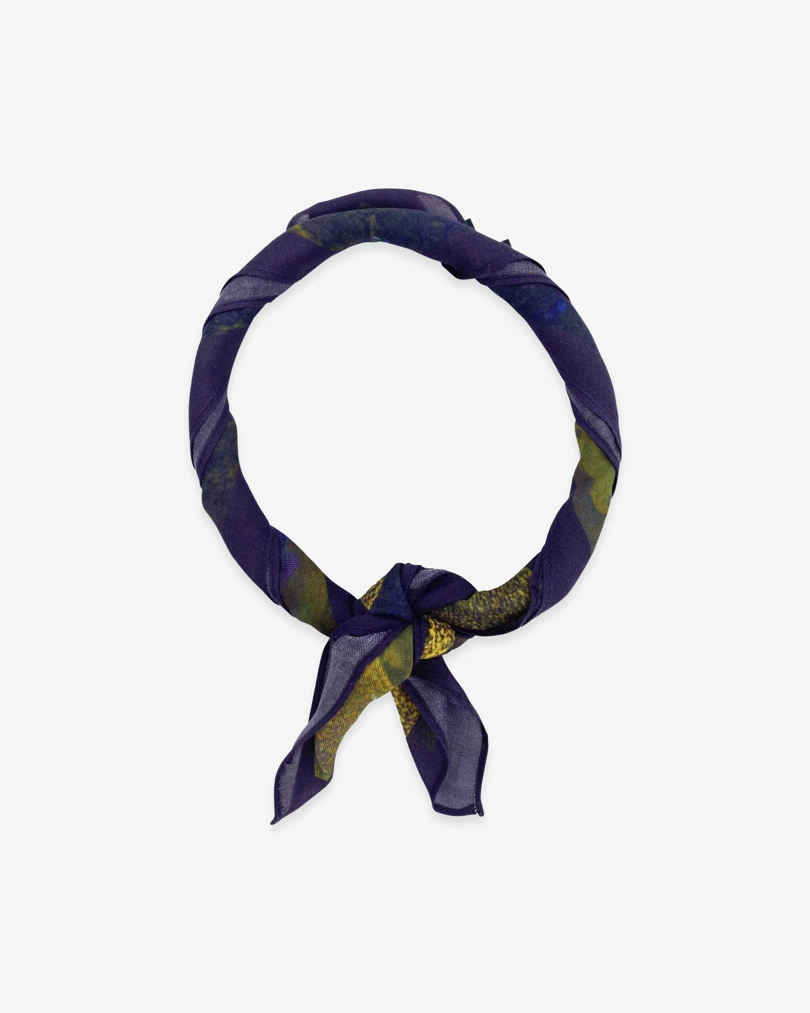 The Alps bandana knotted into a loop, showing the subtle violet and blue tones of the modal-wool fabric.