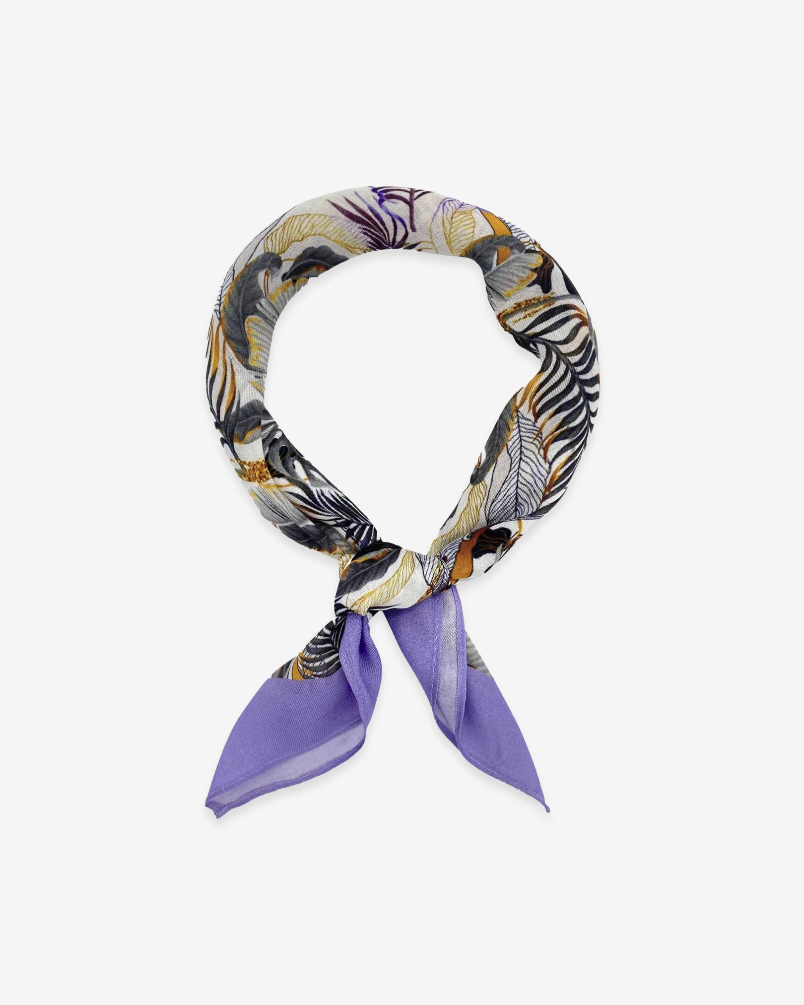 The Andes bandana knotted loosely into a loop, indicating the range of earthy and purple tones of the modal-wool fabric.