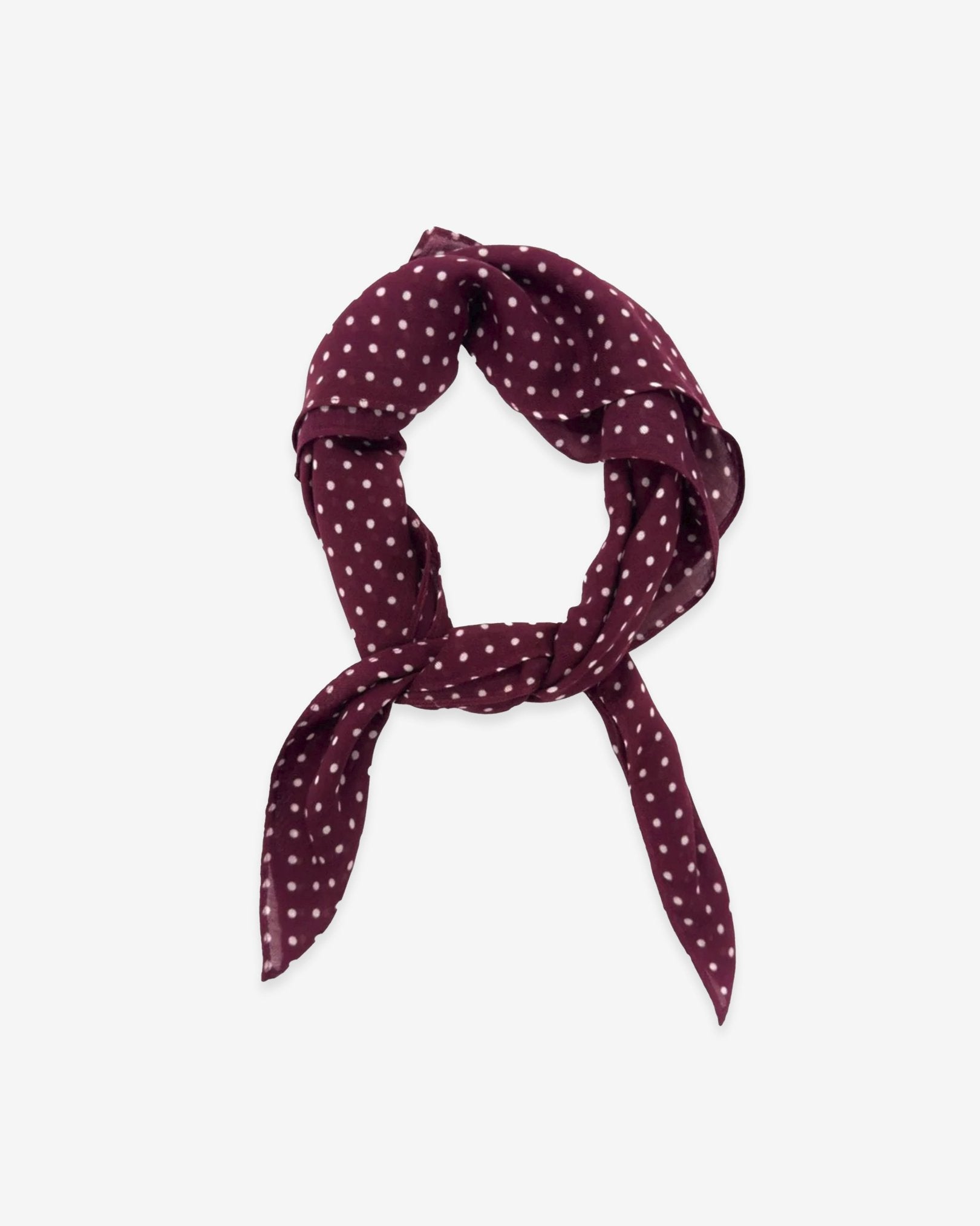 The Sapporo bandana knotted into a loop, showing the attractive white polka dot pattern against a burgundy ground.