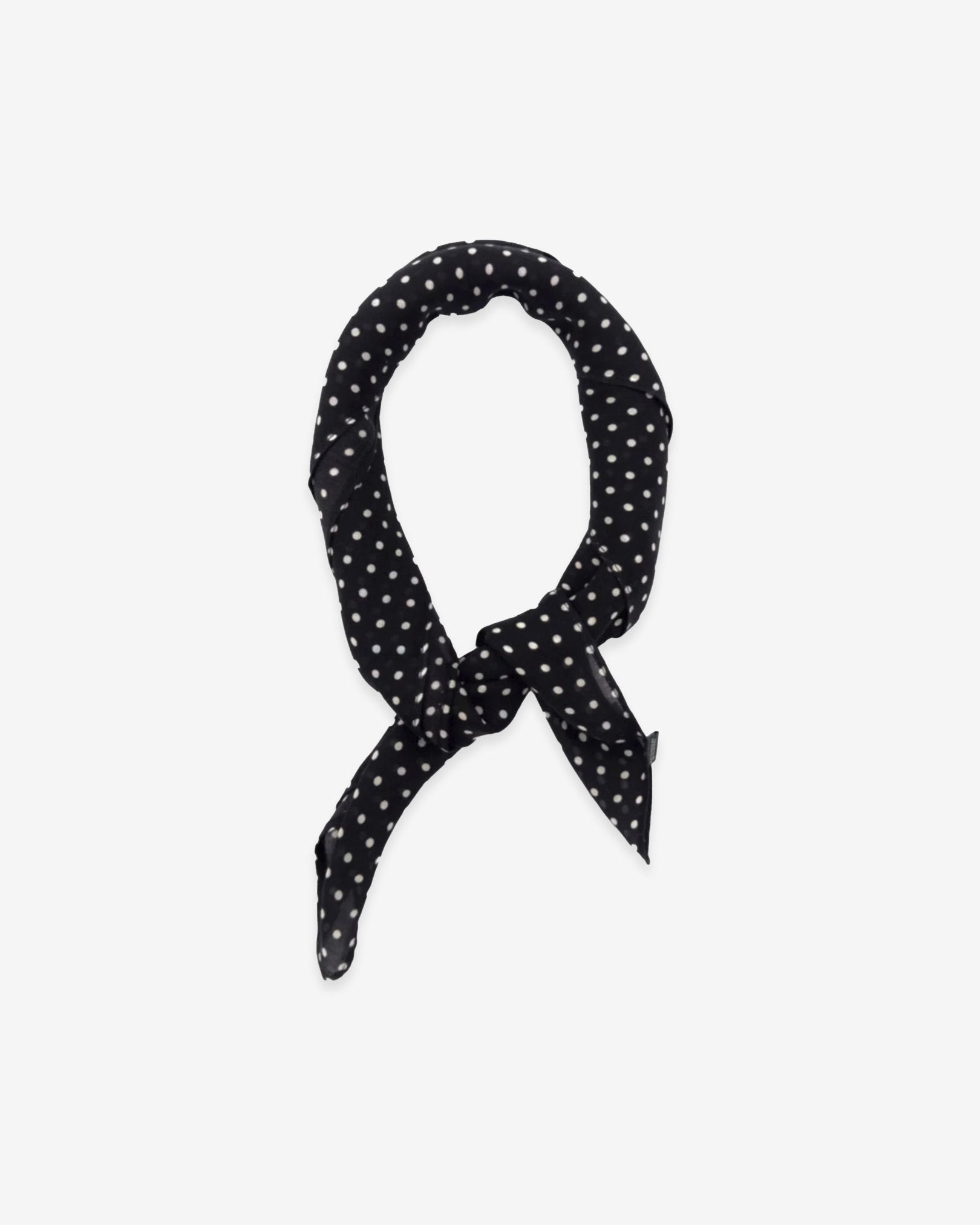 The Shinagwa bandana knotted into a loop, showing the attractive white polka dot pattern against a black ground.