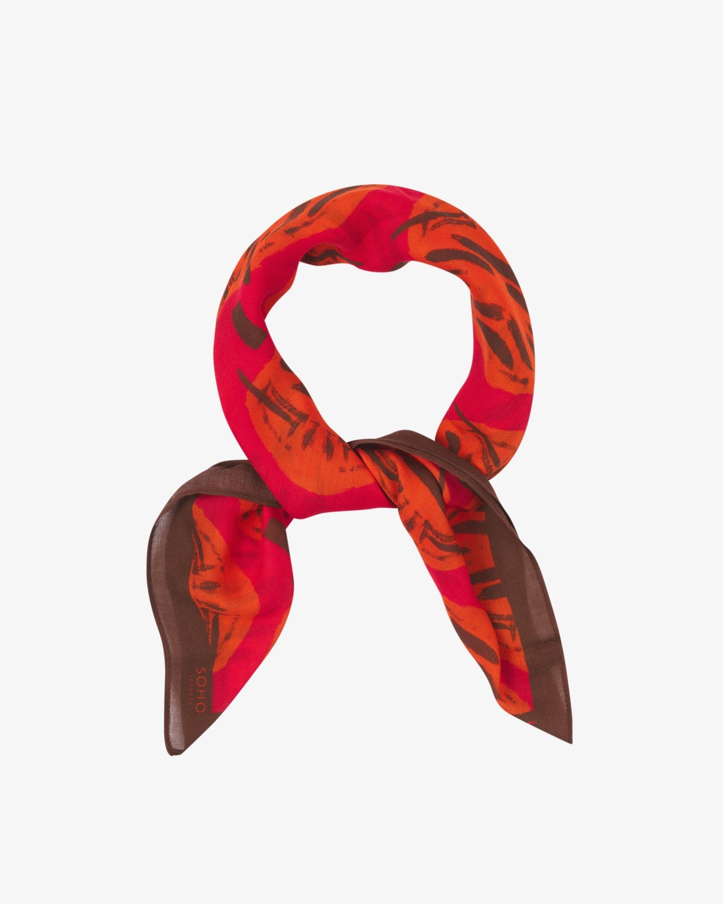 The Sierra bandana knotted into a loop, showing the bright, autumnal colours of the modal-wool fabric.