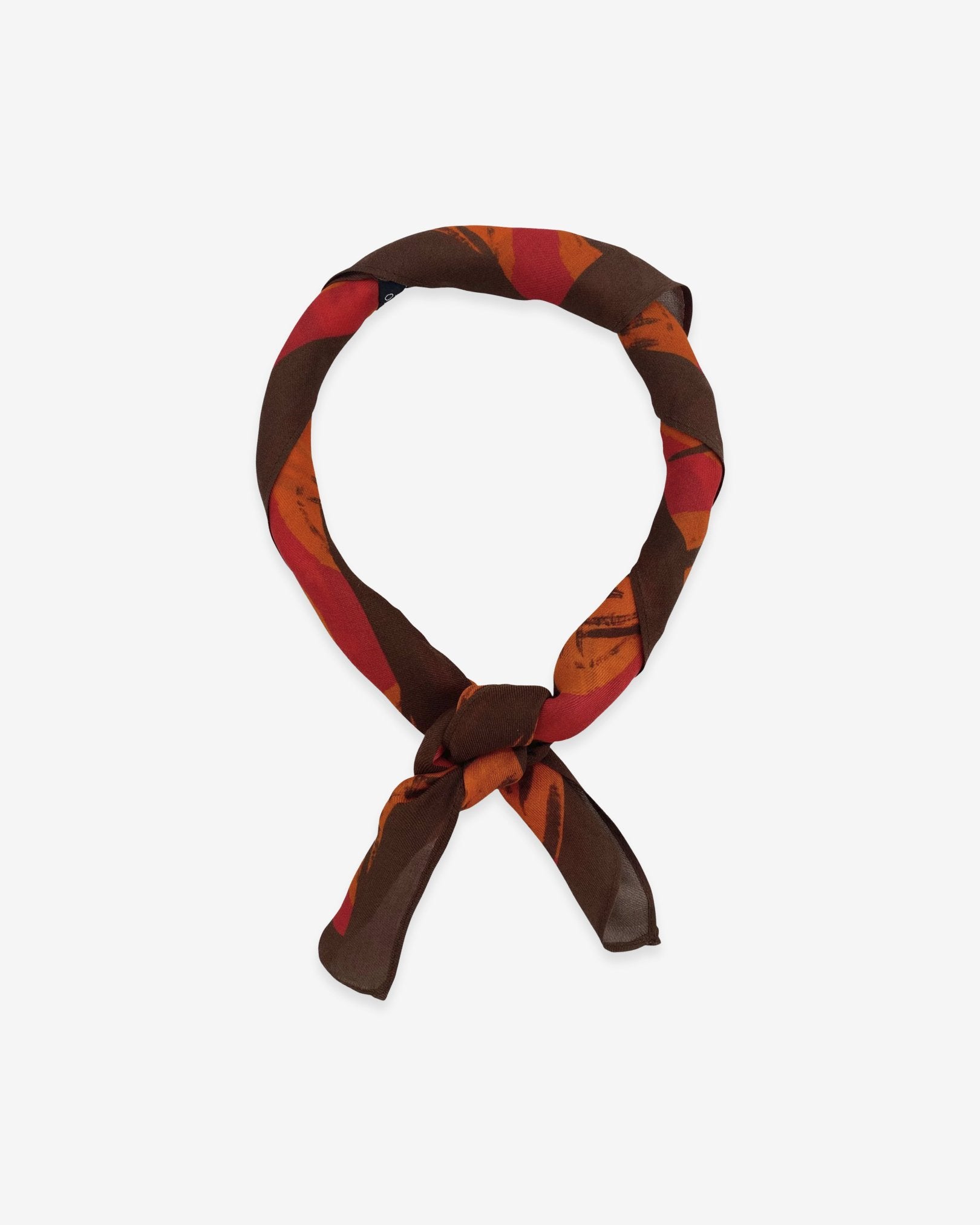 The Sierra bandana knotted into a loop, showing the bright, autumnal colours of the modal-wool fabric.