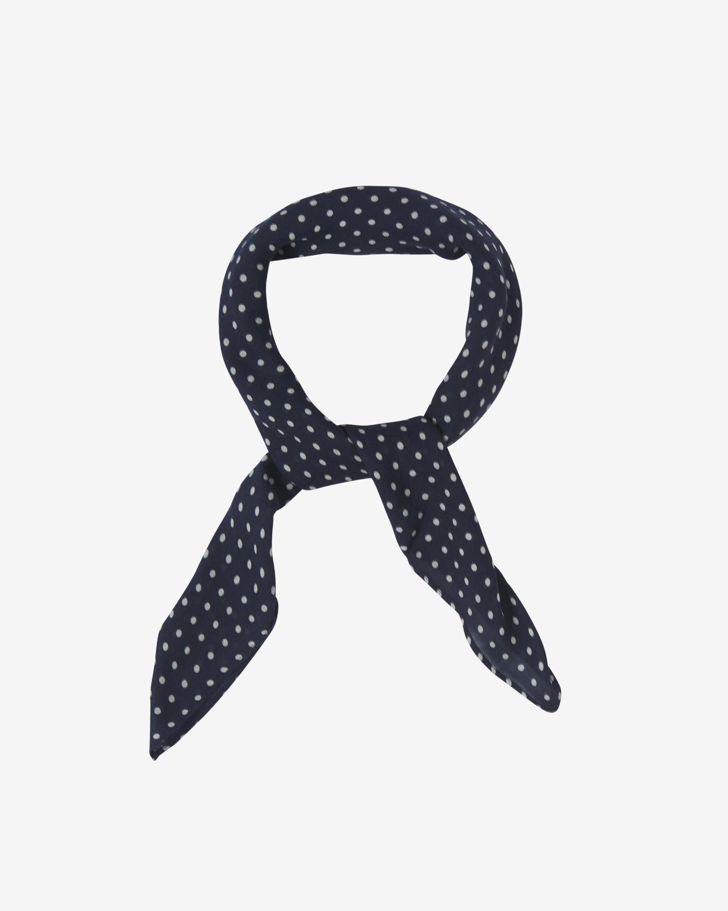 The Westminster bandana knotted into a loop, showing the attractive white polka dot pattern against a navy blue ground.