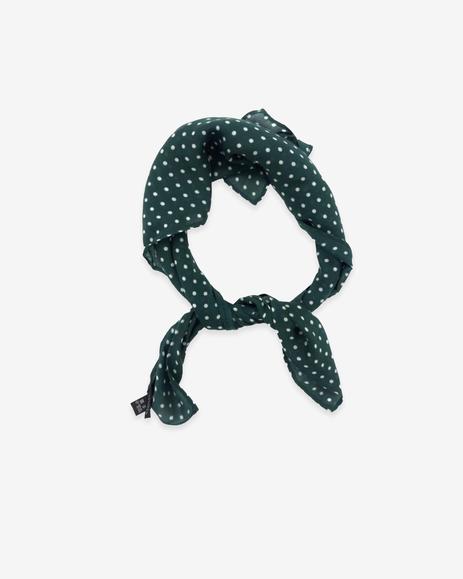 The Westminster Racing Green bandana knotted into a loop, showing the attractive white polka dot pattern against a racing green ground.