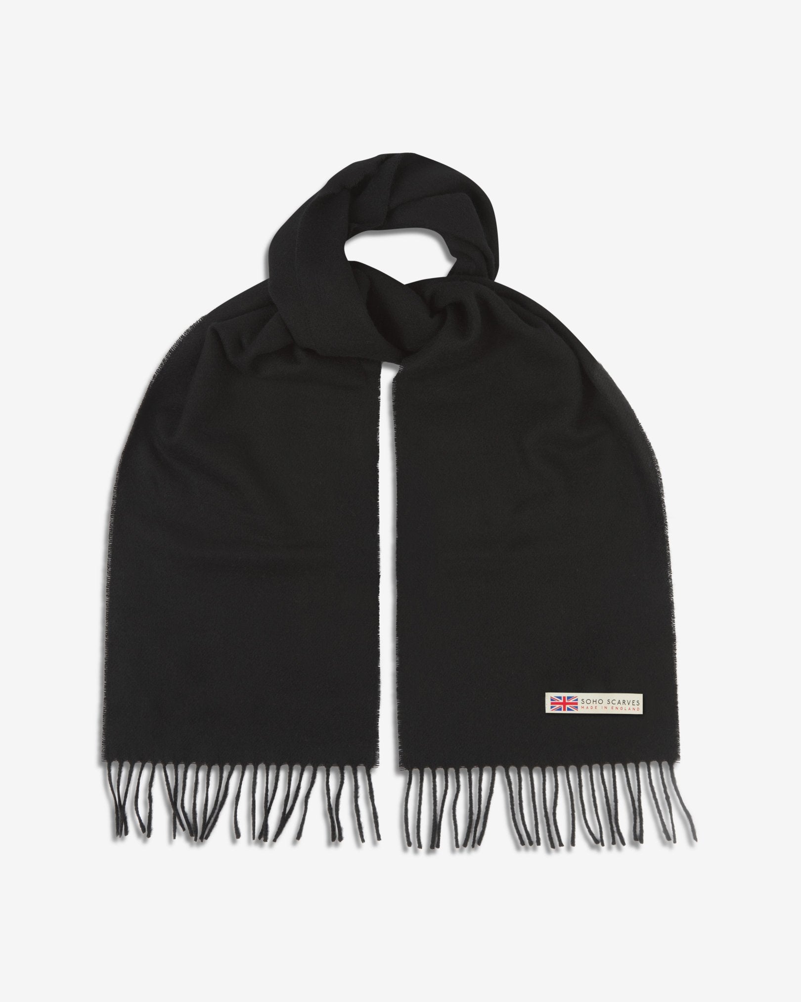 The 'lowlands' in black scarf, looped in middle with both ends parallel showing the fringing and SOHO Scarves logo with Union Jack motif.