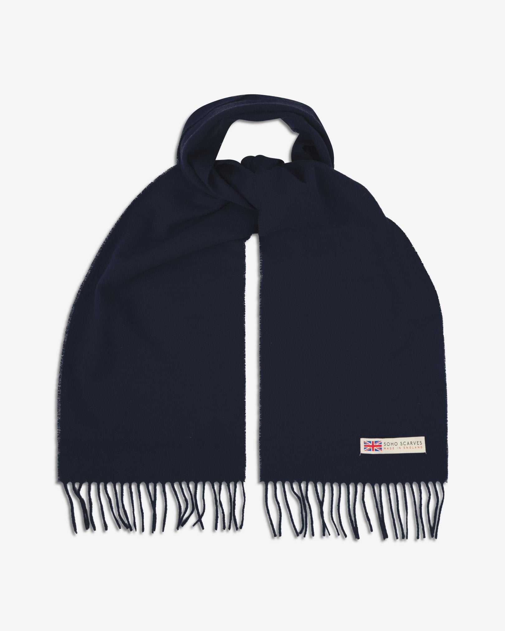 The 'lowlands' in navy blue scarf, looped in middle with both ends parallel showing the fringing and SOHO Scarves logo with Union Jack motif.