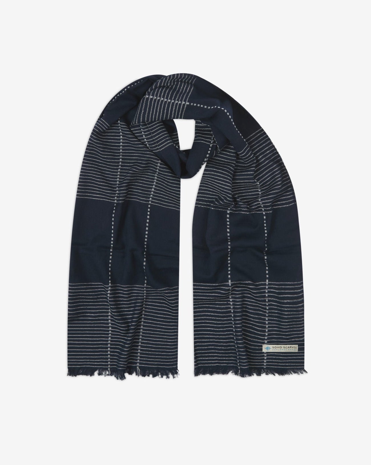 The 'Peake' cotton plaid and pinstripe scarf, looped in middle with both ends parallel. Displaying the navy blue fabric with vertical and horizontal thread stripes and the SOHO Scarves Explorer Range logo.