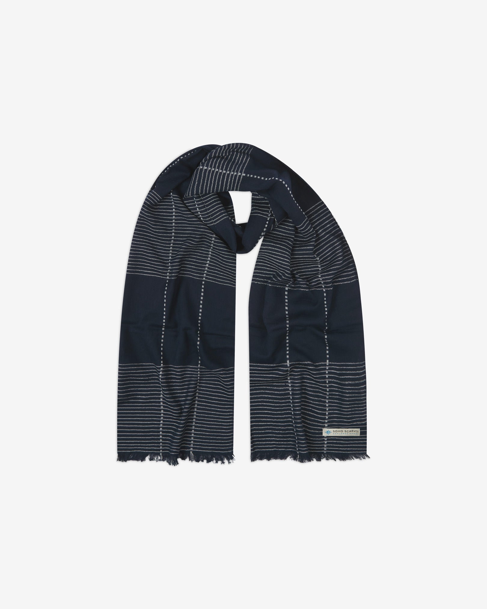 The 'Peake' cotton plaid and pinstripe scarf, looped in middle with both ends parallel. Displaying the navy blue fabric with vertical and horizontal thread stripes and the SOHO Scarves Explorer Range logo.