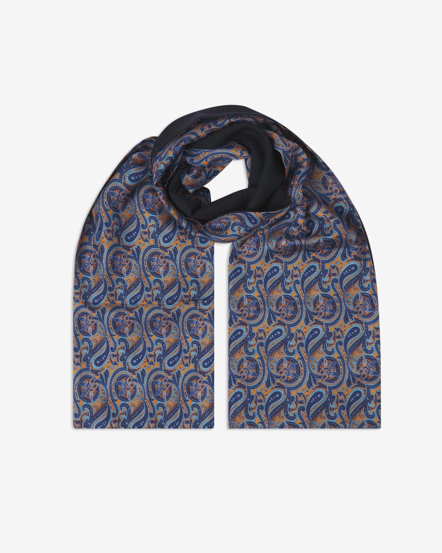 The Roppongi wool-backed silk scarf. Unravelled and looped in the middle, showing the length, width and paisley pattern on silk.