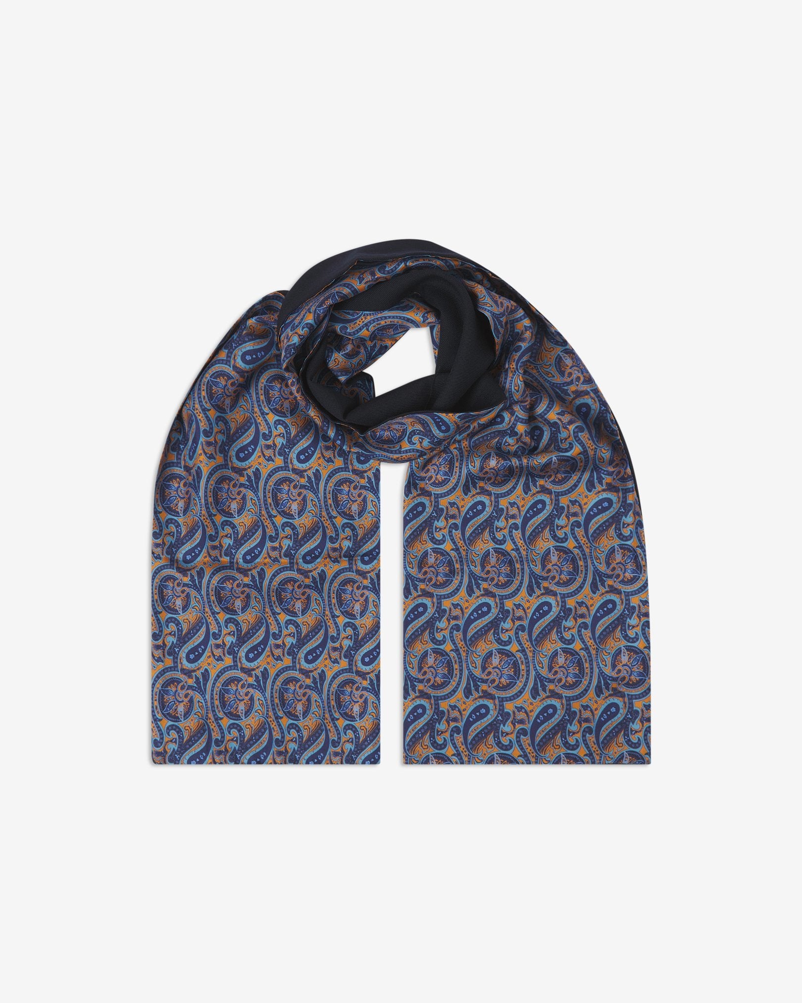 The Roppongi wool-backed silk scarf. Unravelled and looped in the middle, showing the length, width and paisley pattern on silk.