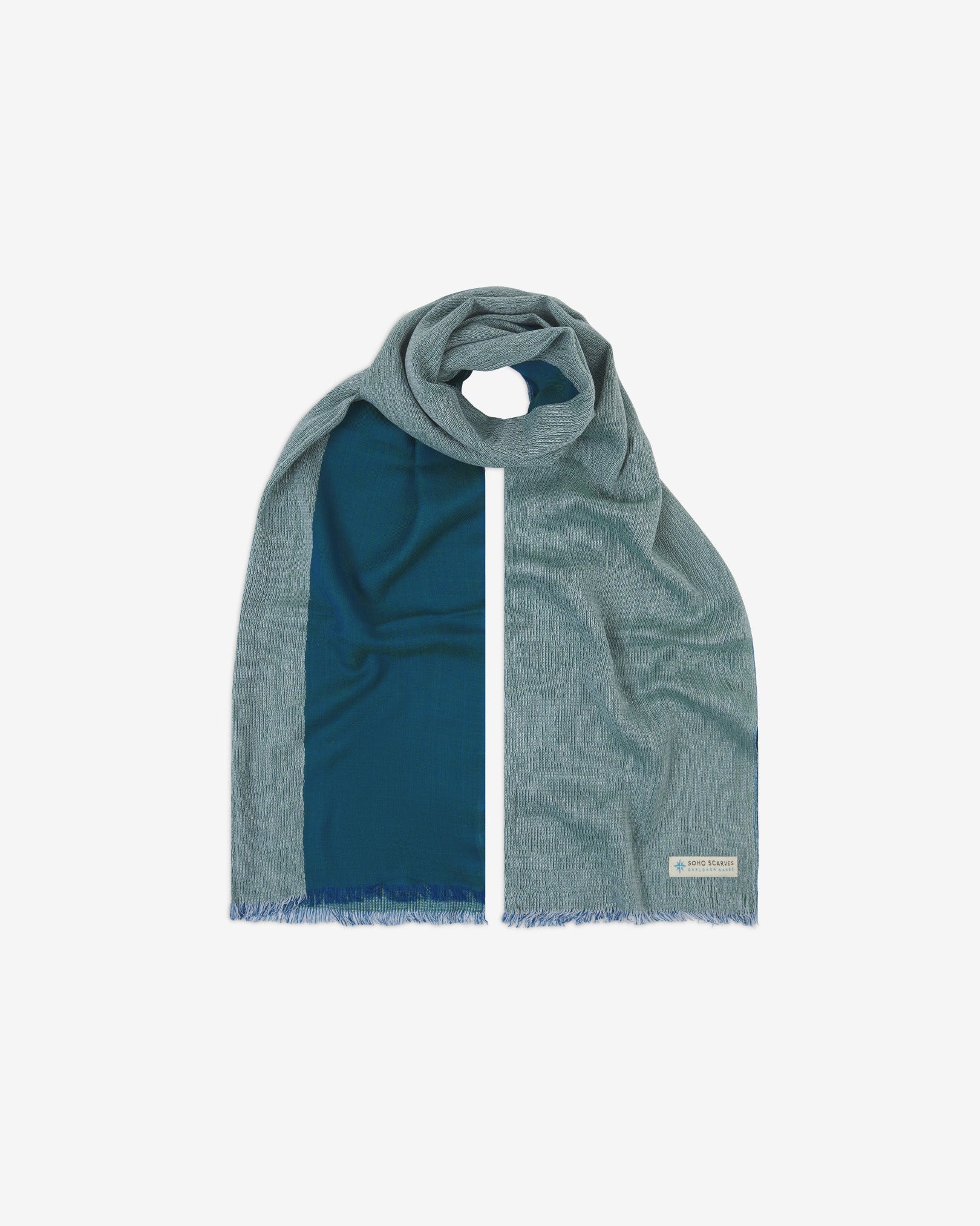 The 'Saunders' cotton heathered scarf, looped in middle with both ends parallel. Displaying the two-tone aquamarine heathered fabric and the SOHO Scarves Explorer Range branding logo in the bottom-right.