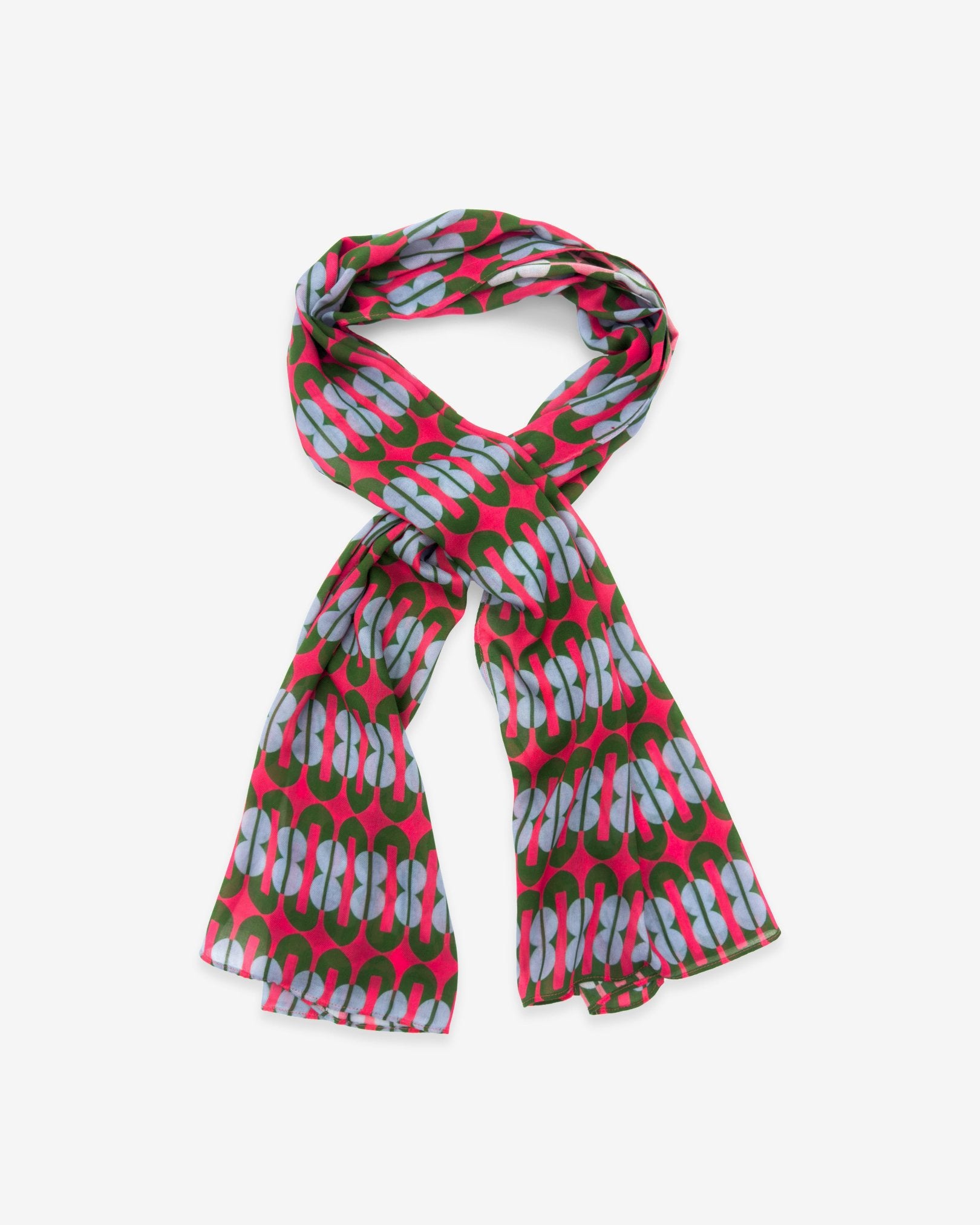 The Trio wide scarf looped with ends trailing on either side, demonstrating the generous scarf length and combined ‘figure 8’ patterns on a shocking pink ground.