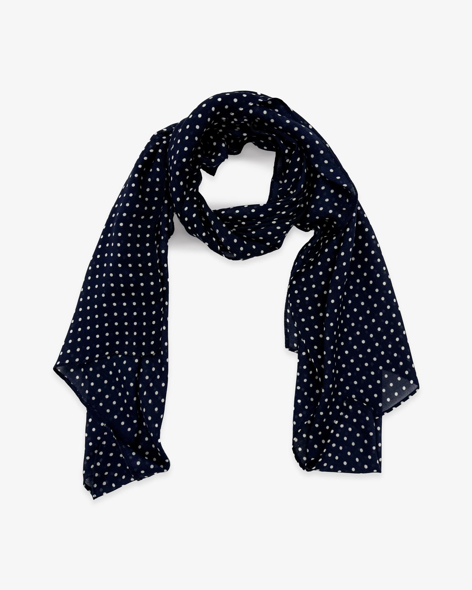 The Westminster wide scarf unravelled and looped in the middle, demonstrating the longer scarf length and polka dot patterns.