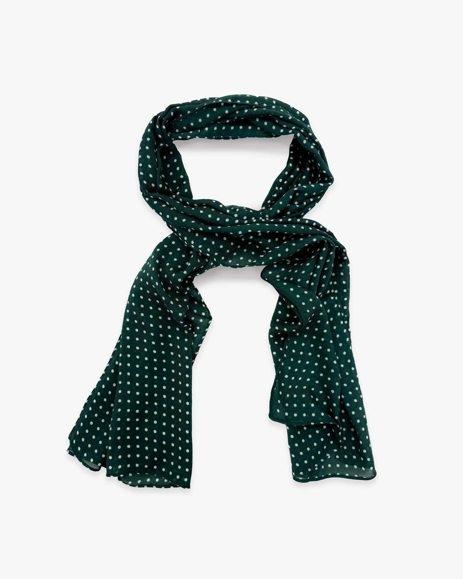The Westminster Racing Green wide scarf unravelled and looped in the middle, demonstrating the longer scarf length and polka dot patterns.