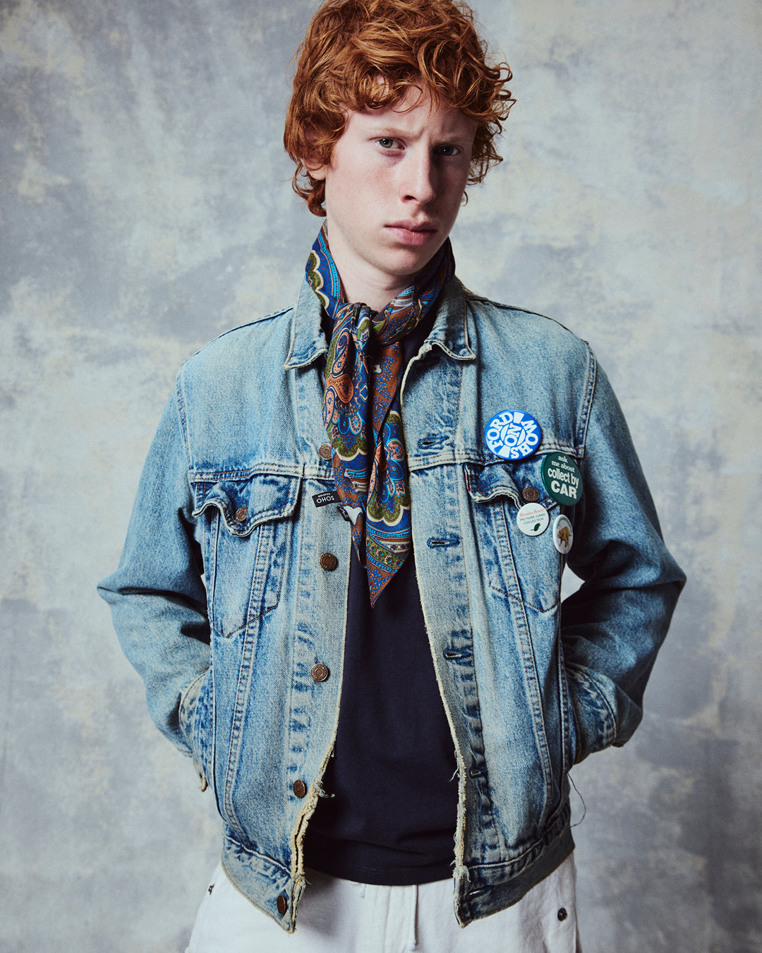 Top-half view of man wearing the 'The Montreal' multicoloured paisley patterned bandana. Tied snugly around neck in a simple tuck.