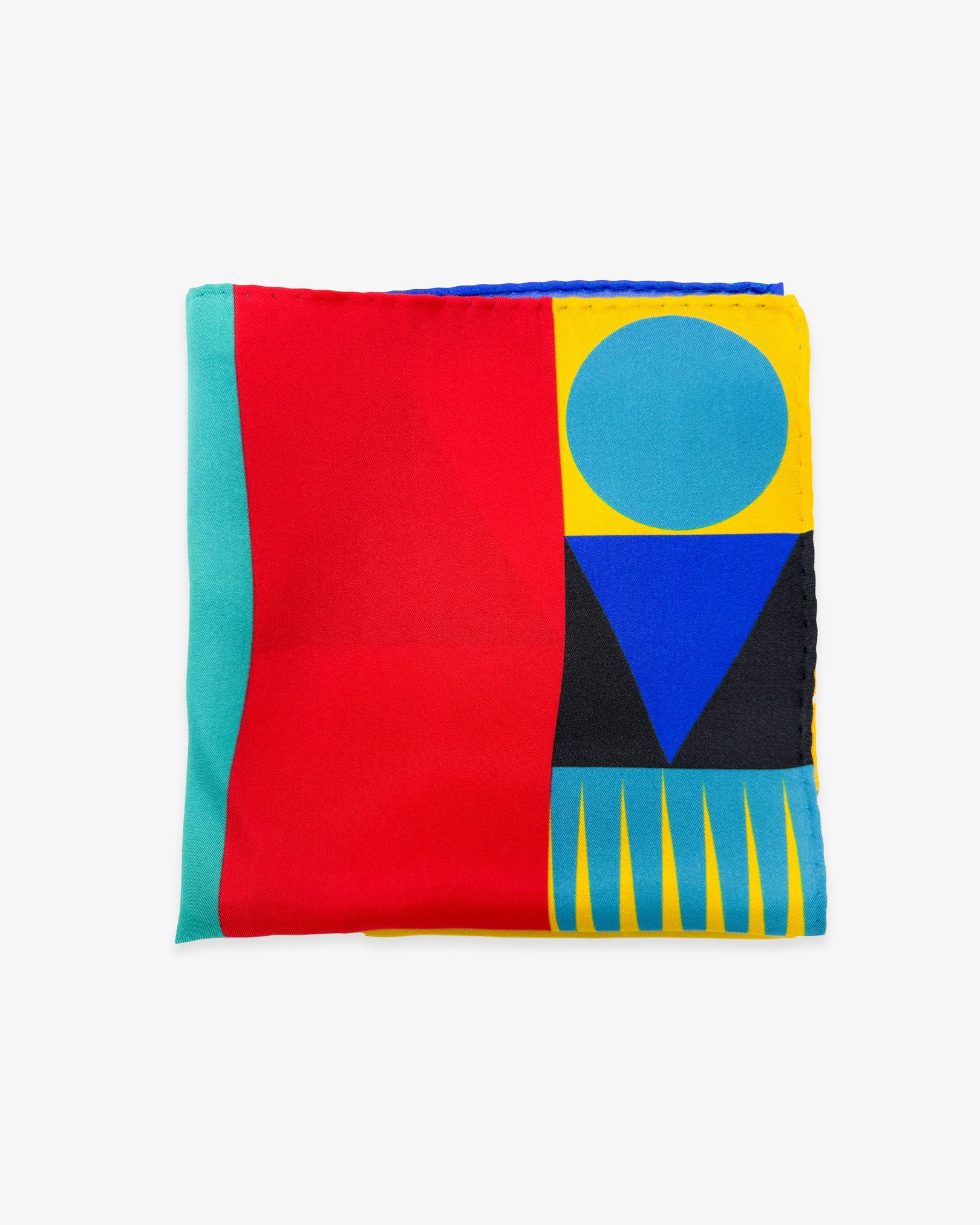 The 'Munich' silk pocket square from SOHO Scarves folded into a quarter, showing part of the multi-coloured pattern combining many familiar Bauhaus-inspired forms.