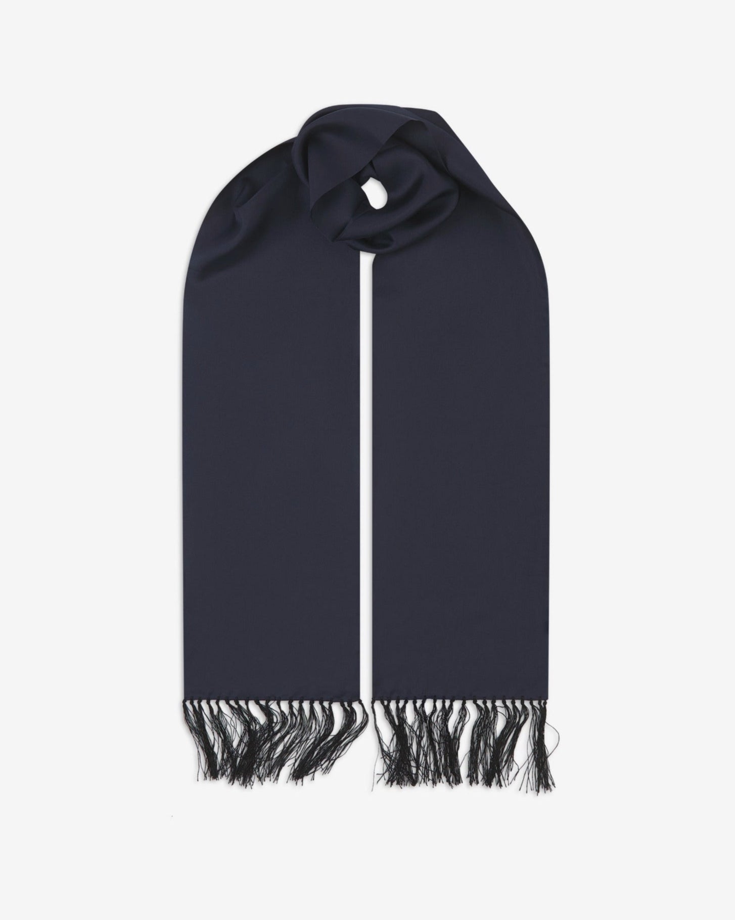 Navy-blue silk aviator scarf from Soho Scarves. Looped with both ends parallel showing the branding label to the right and the matching 8cm long fringes.