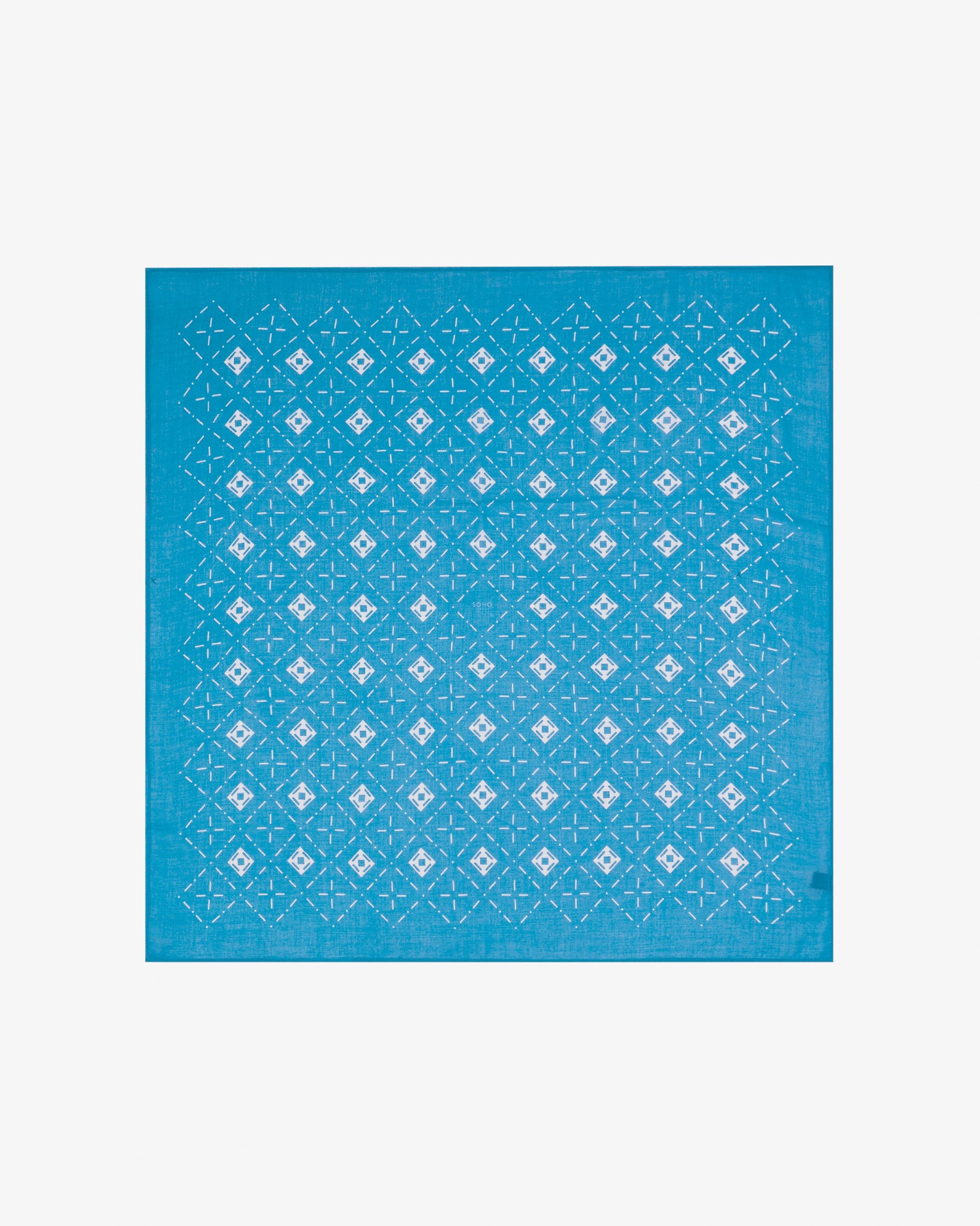 Fully unfolded 'Diamonds in Pacific' modal and wool bandana, displaying the complete repeating diamond mosaic pattern of lozenges and crosshair motifs in contrasting Pacific blue tones framed by a wide border.