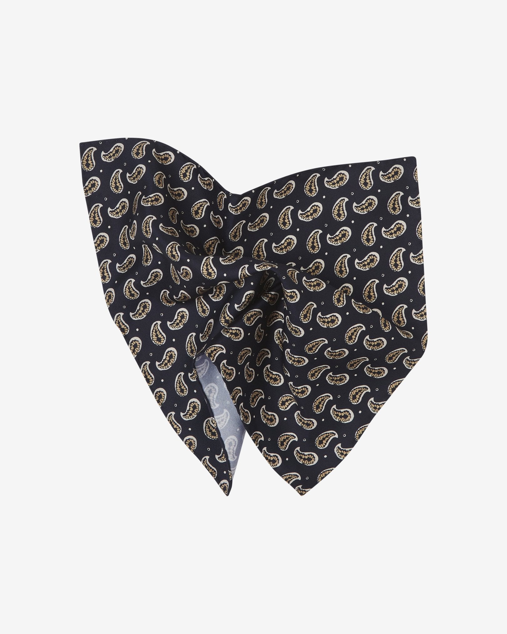 The 'Hadrian' pocket square pinched and twisted in the middle, showing the stylised paisley patterns against a dark navy background.