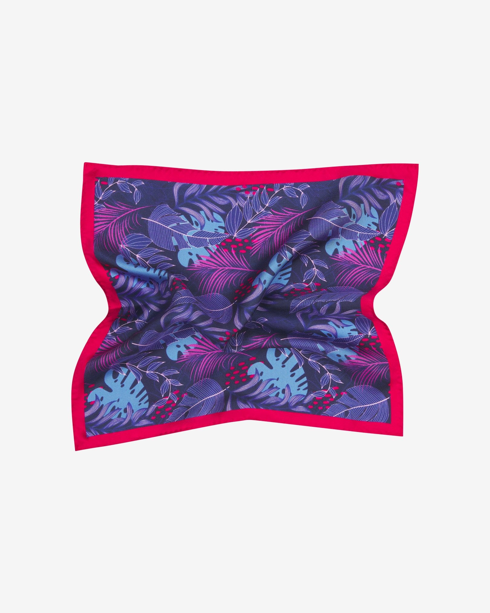 The 'Mersey' silk pocket square pinched and twisted in the middle, showing the leaf montage pattern and bright red border.