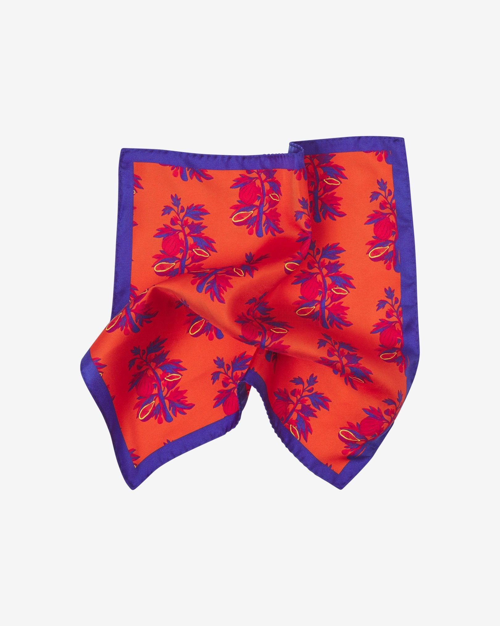 The 'Severn' silk pocket square pinched and twisted in the middle, showing the repeat motif in purple and red.