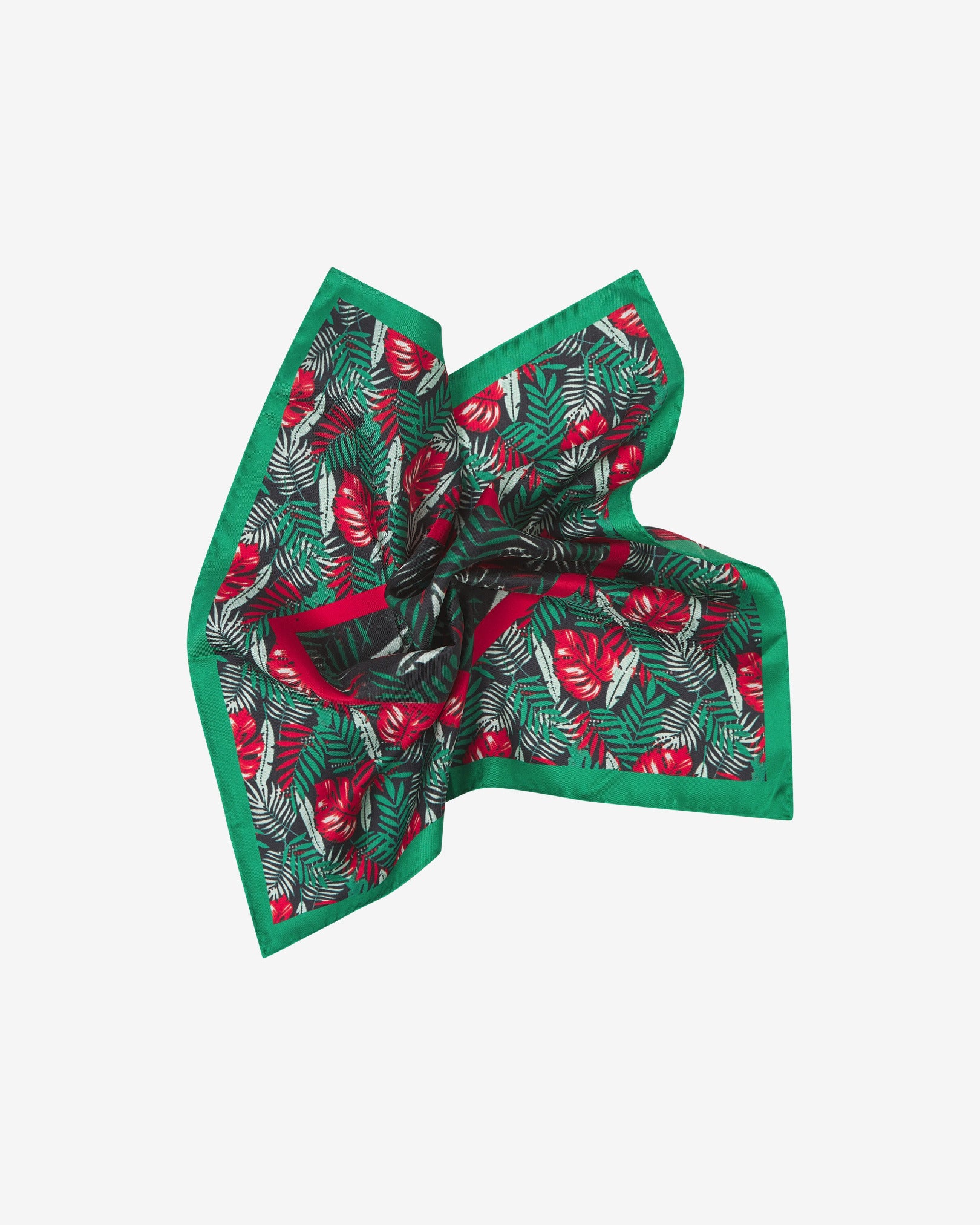 The 'Swayle' pocket square pinched and twisted in the middle, showing the attractive green and red floral pattern and green border.