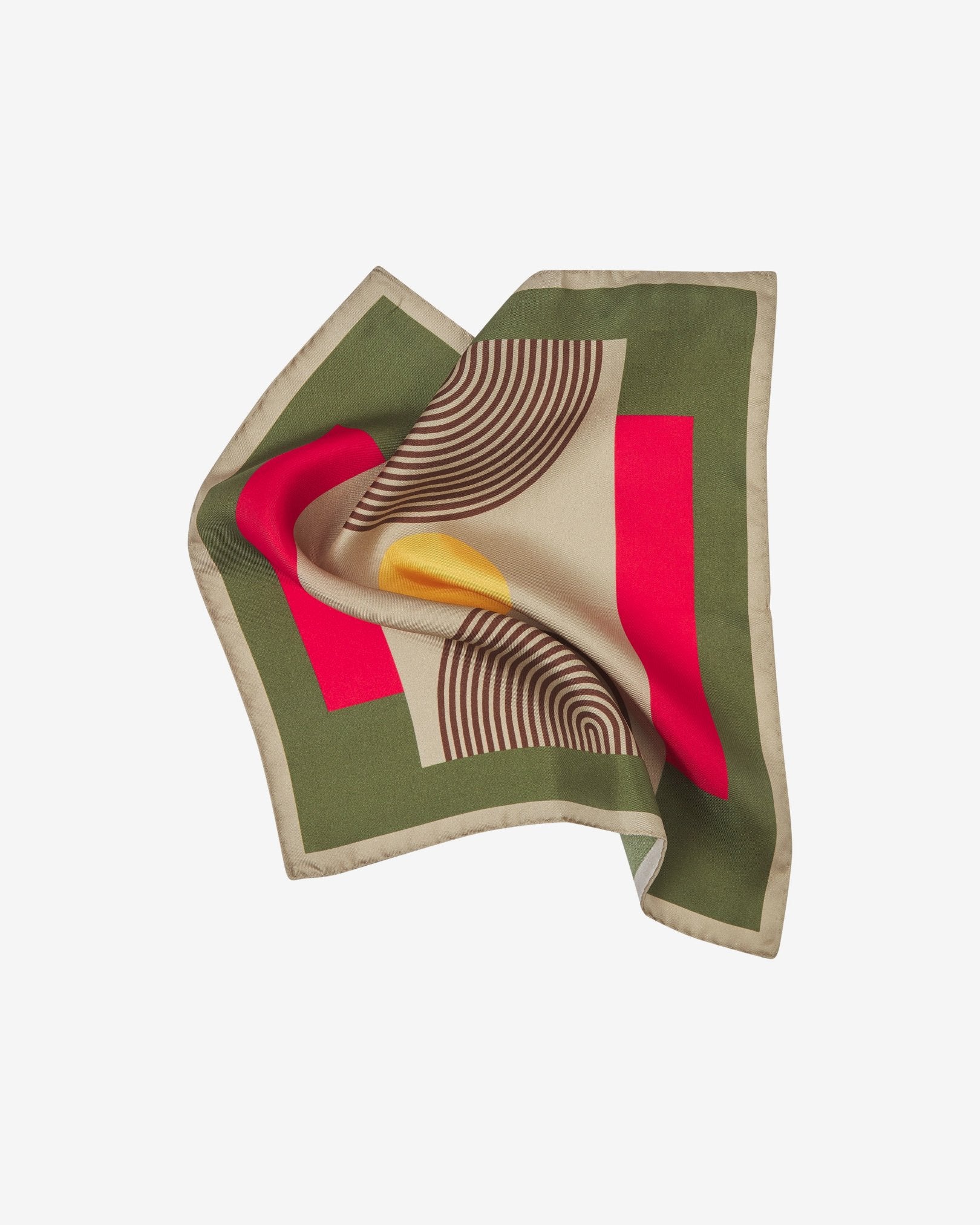 The 'Tay' silk pocket square pinched and twisted in the middle, showing the retro geometric pattern and cream-coloured border.