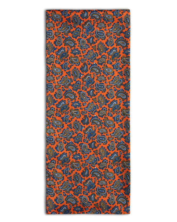 'The Asakusa' paisley polyester scarf arranged in a rectangular shape, clearly showing the vibrant orange fabric.