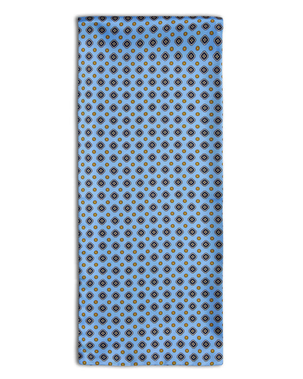 'The Berwick' geometric patterned polyester scarf arranged in a rectangular shape, clearly showing the powder blue fabric with diamond and disc patterns.