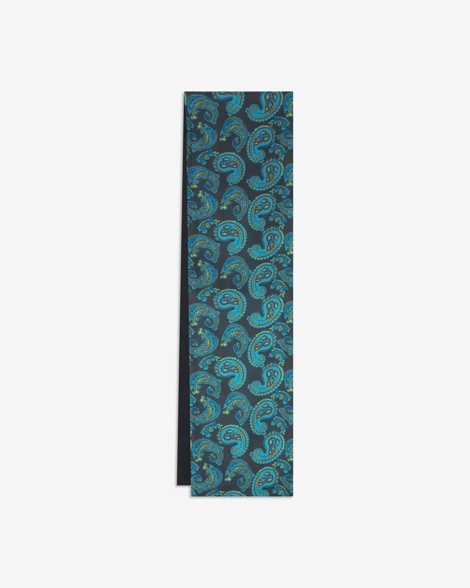 The Bridle dress scarf arranged in a rectangular shape with a focus on the cyan and gold paisley patterns against a dark grey background and the dark woollen underside.